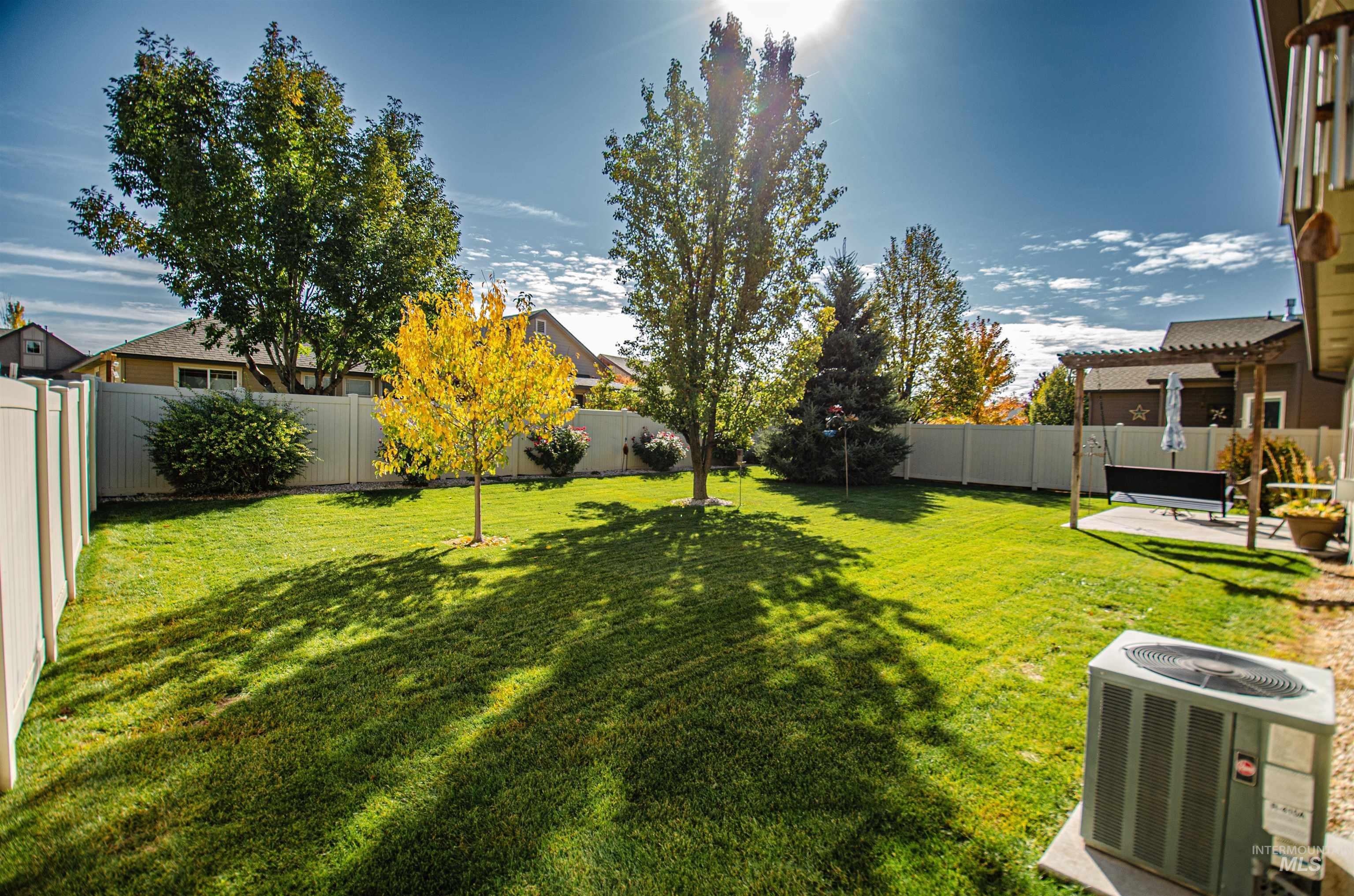 Fenced backyard featuring a patio