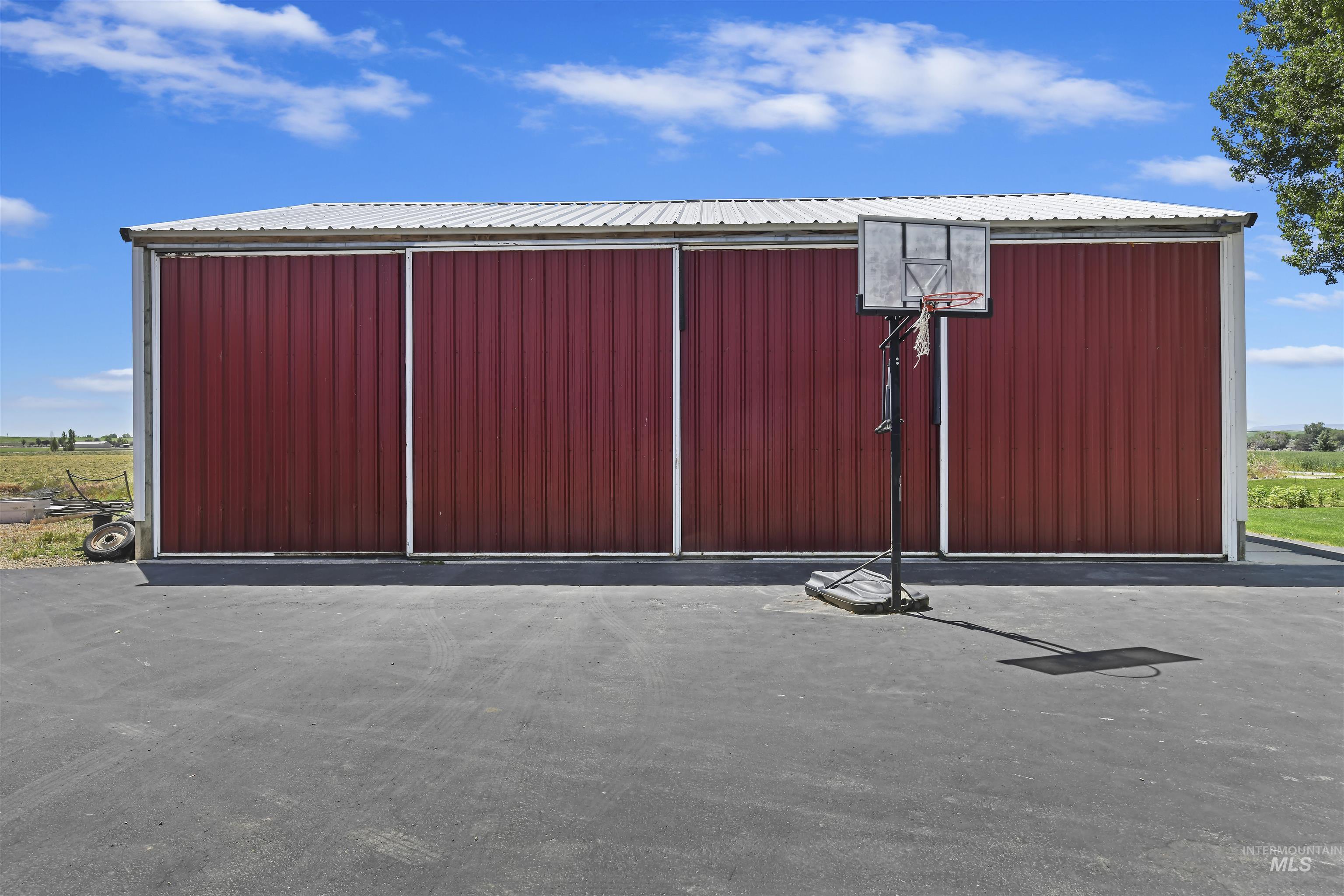 Gate featuring an outbuilding