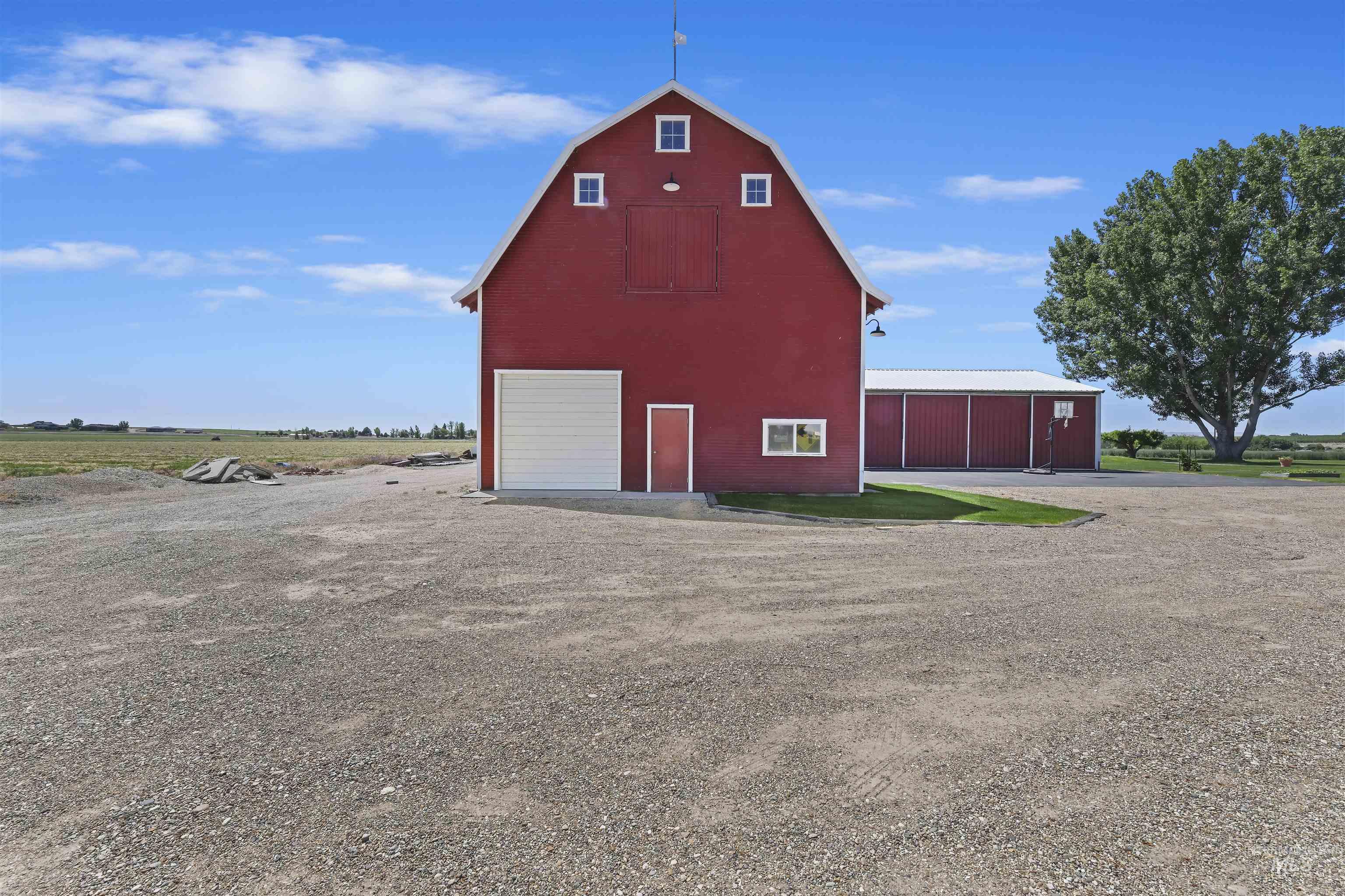 View of barn with driveway