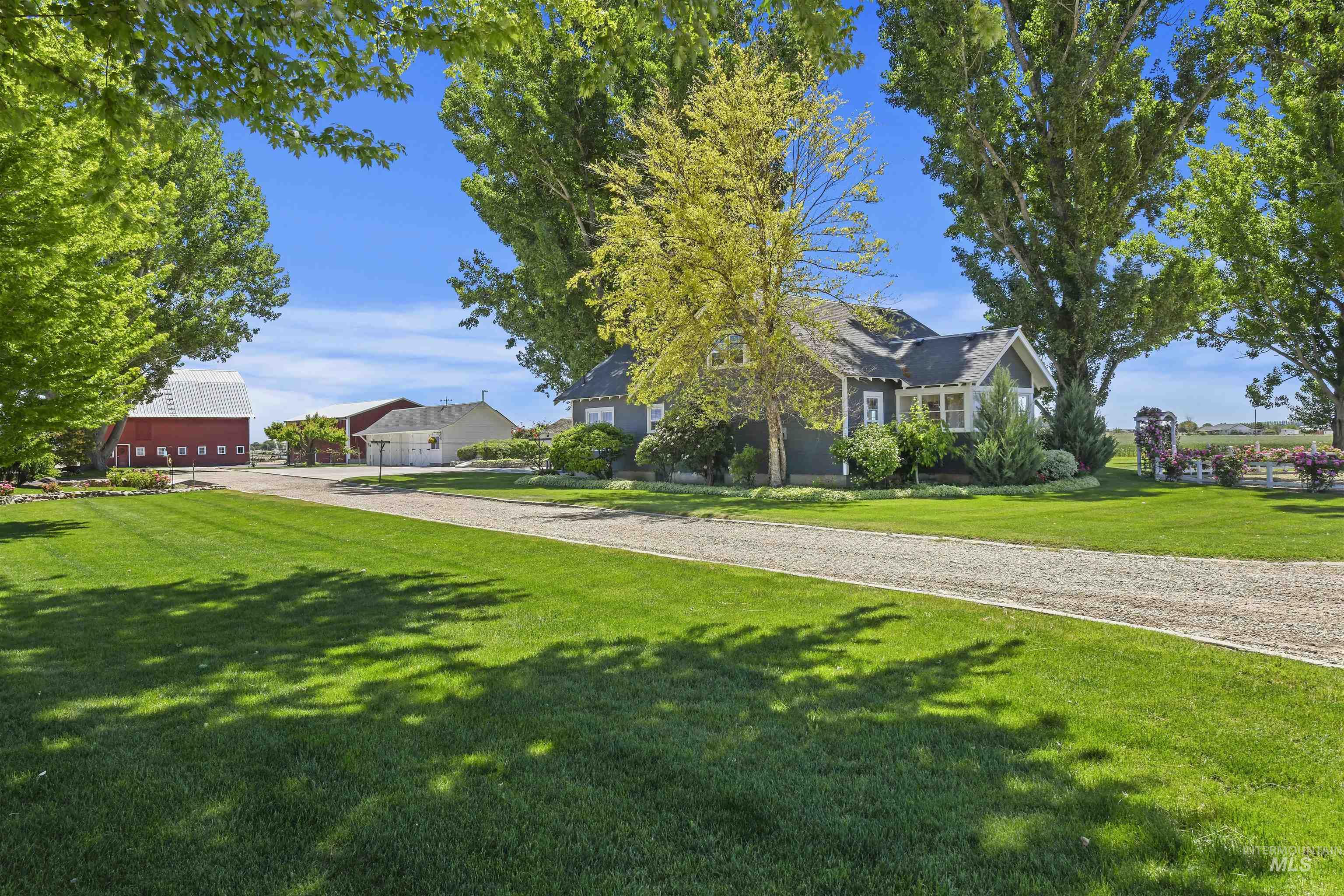 View of front of house featuring a front lawn and driveway