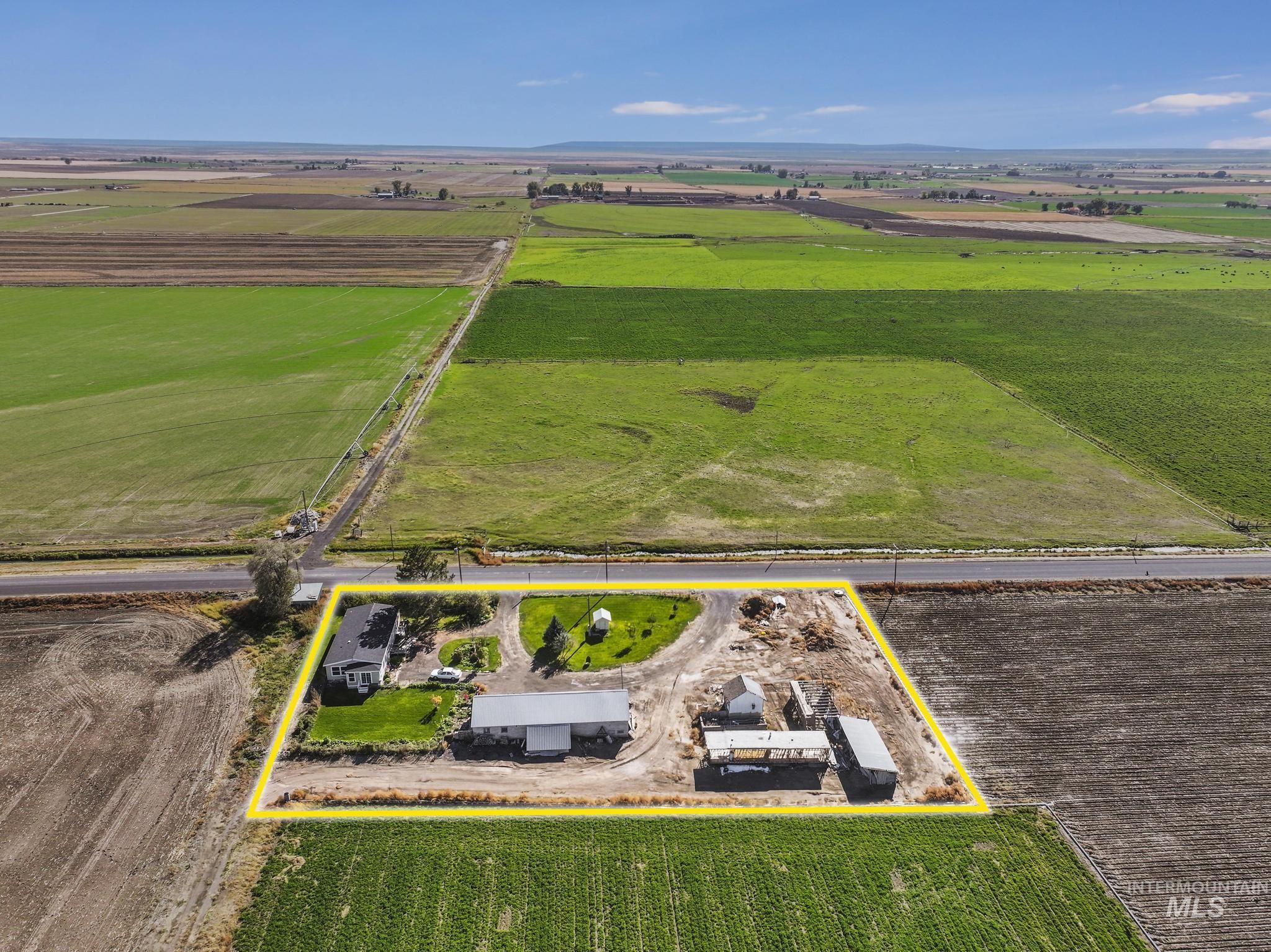 Overview of rural landscape with rows of crops and property boundaries highlighted