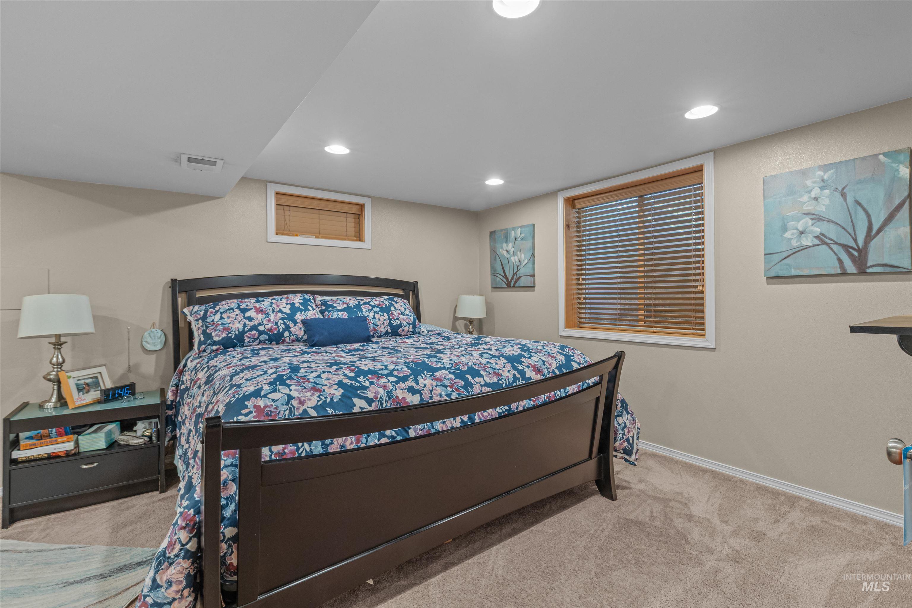 Bedroom with carpet floors and recessed lighting