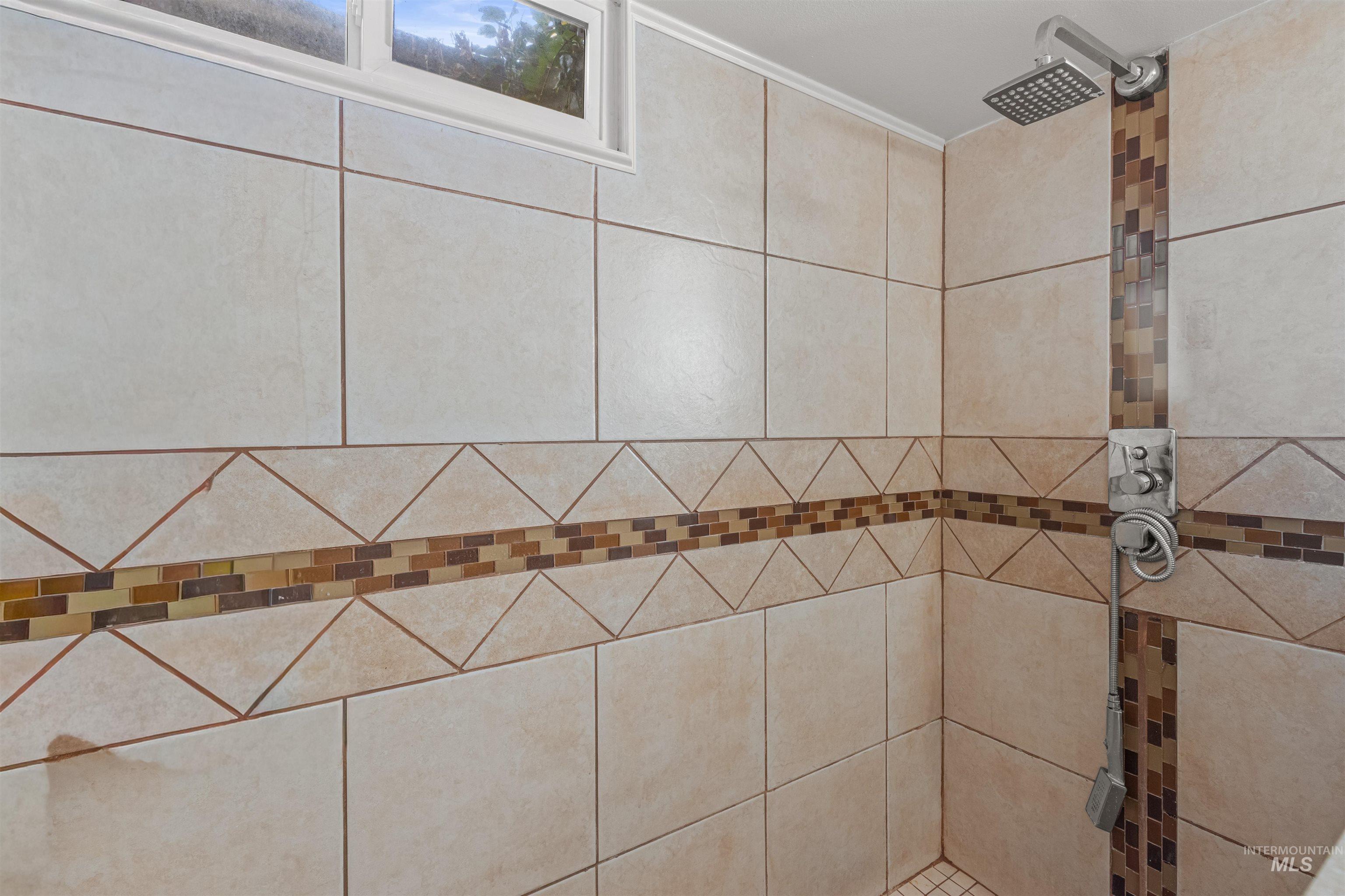 Bathroom view of a tile shower