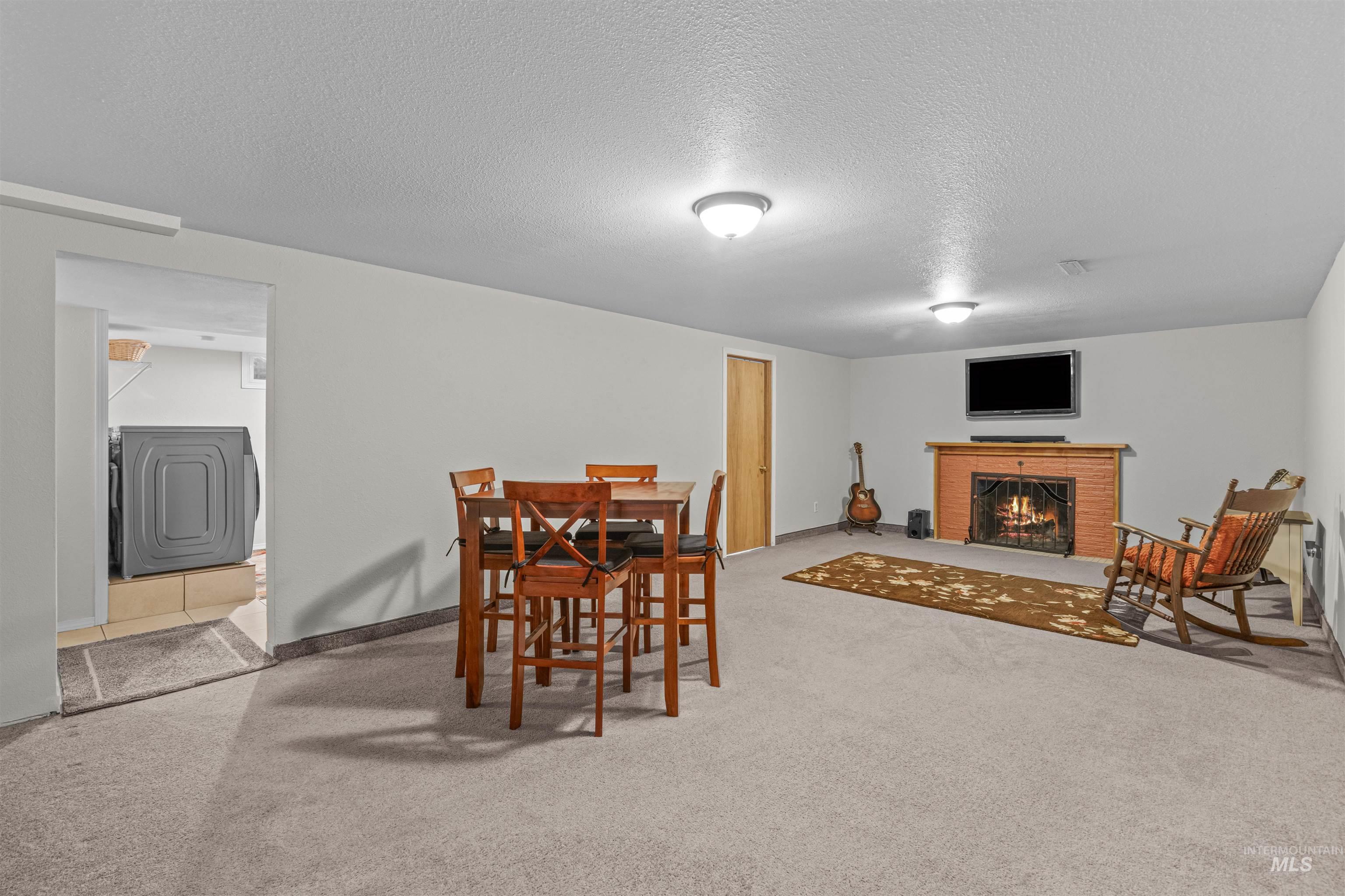 Basement recreation room with gas fireplace