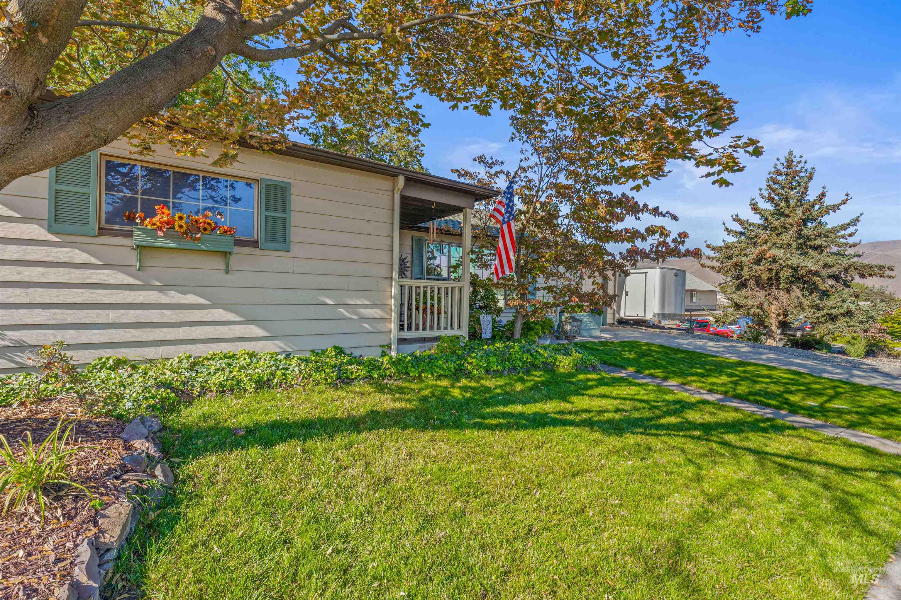 View of home's exterior with a yard