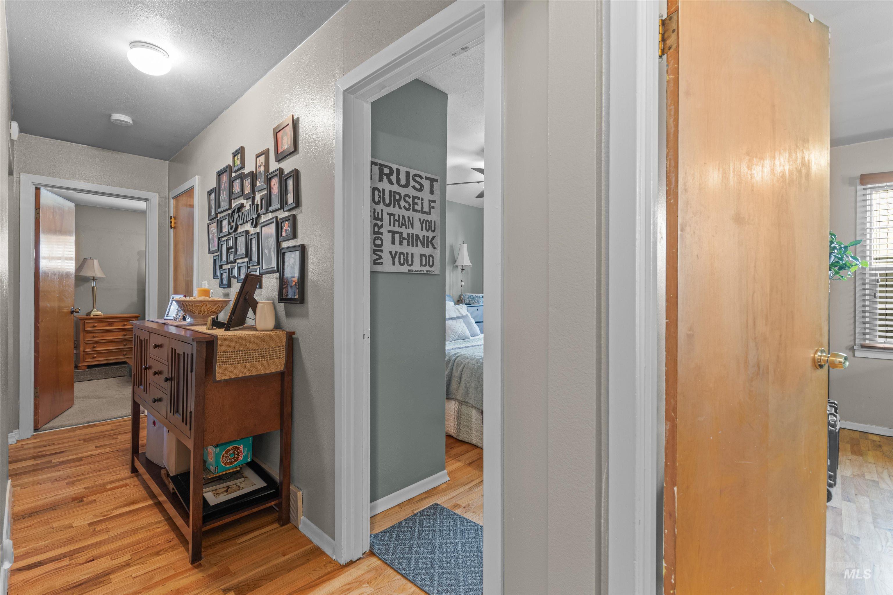 Hallway with light wood-style flooring
