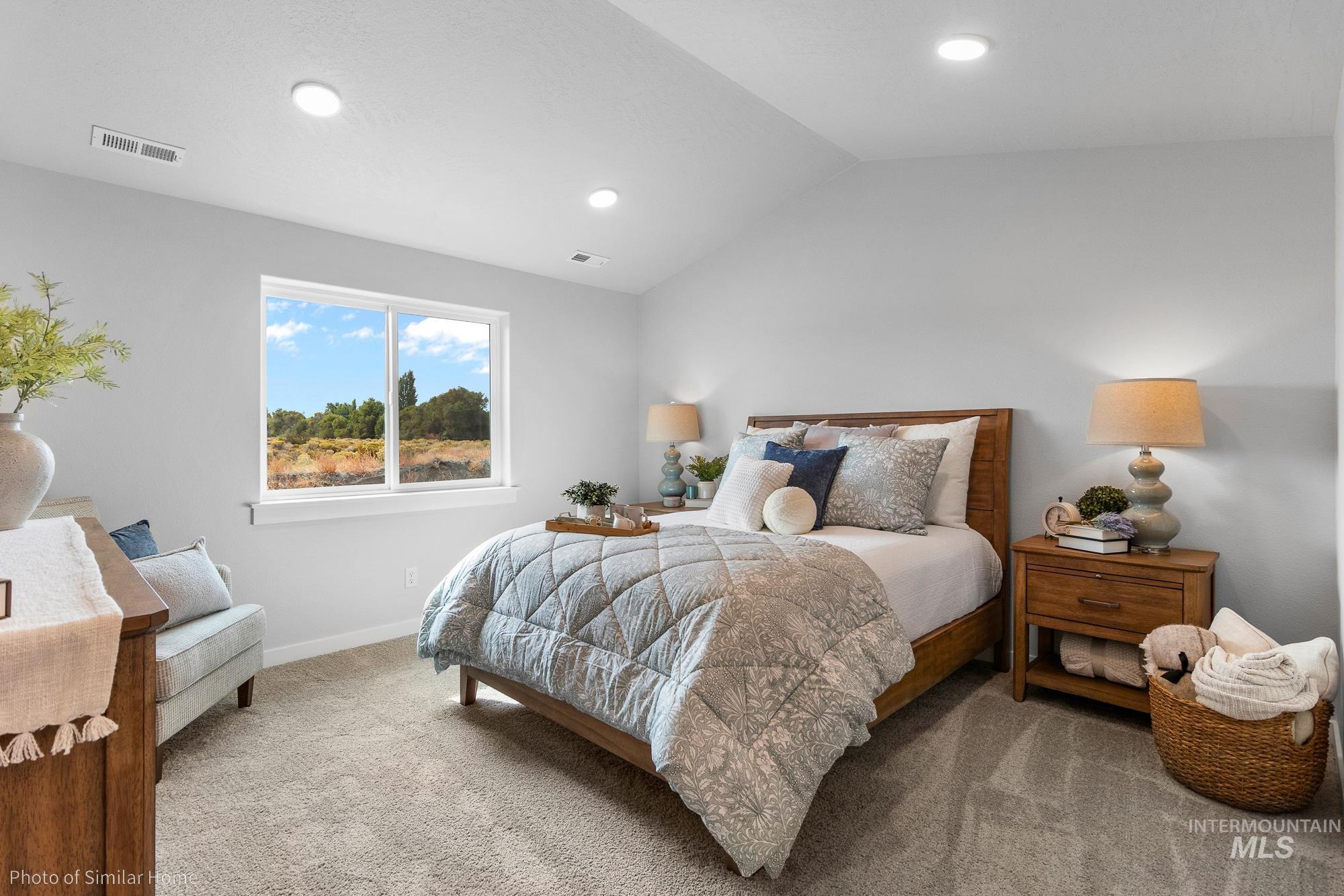 Bedroom featuring lofted ceiling, carpet flooring, and recessed lighting