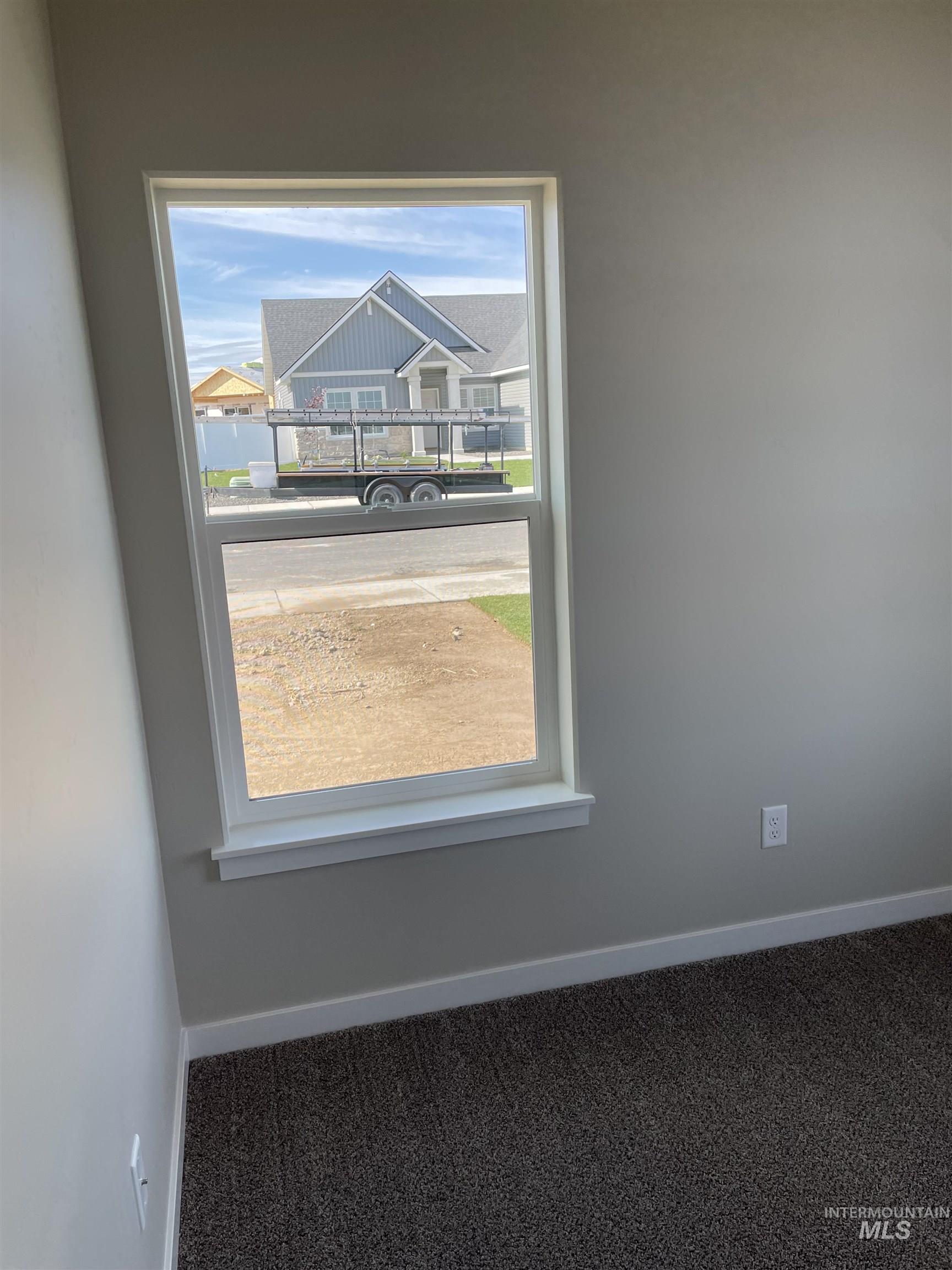 Detailed view of carpet and baseboards