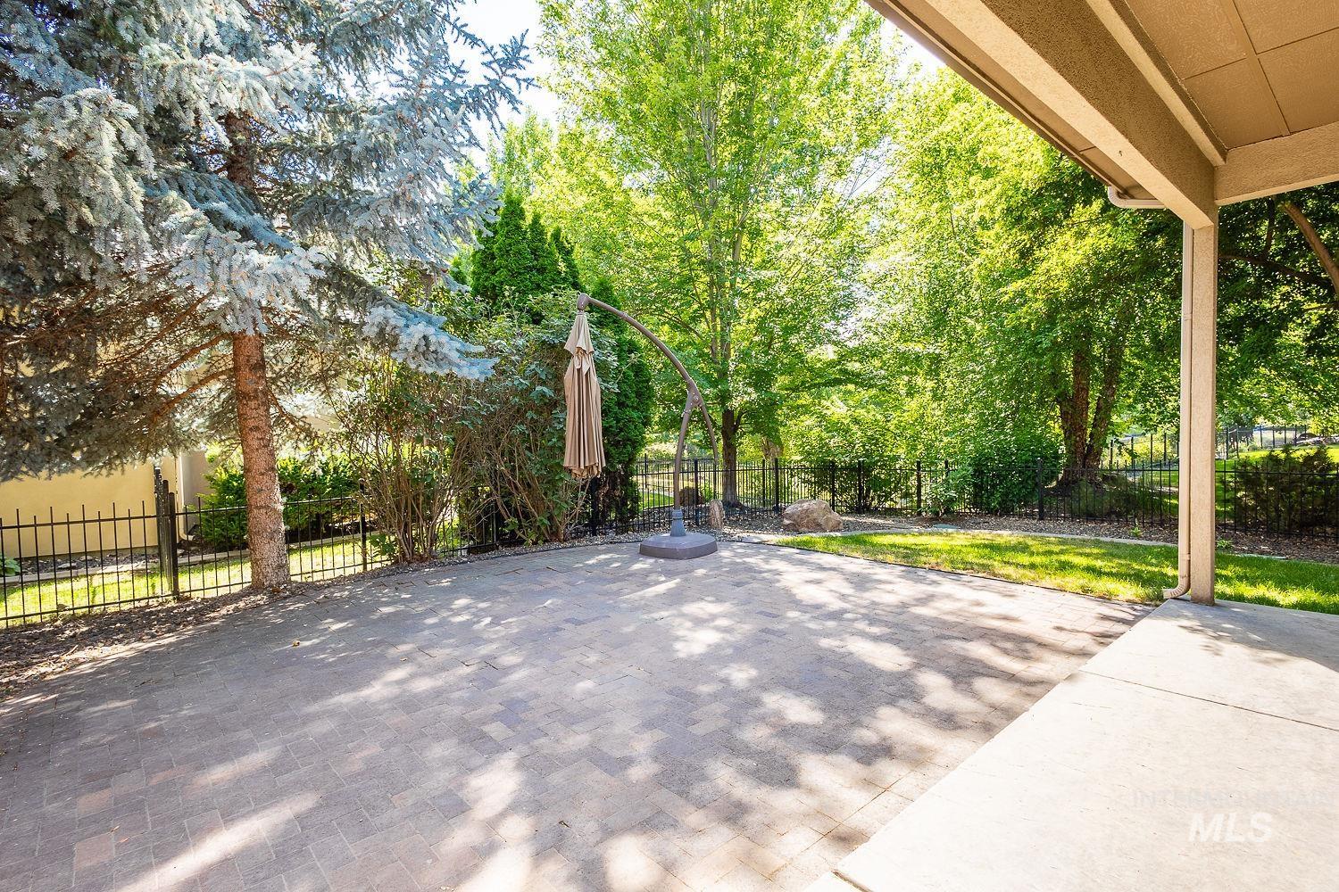 Fenced backyard featuring a patio