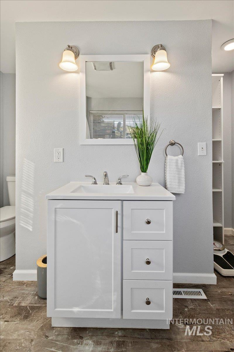 Full bathroom featuring vanity and an enclosed shower