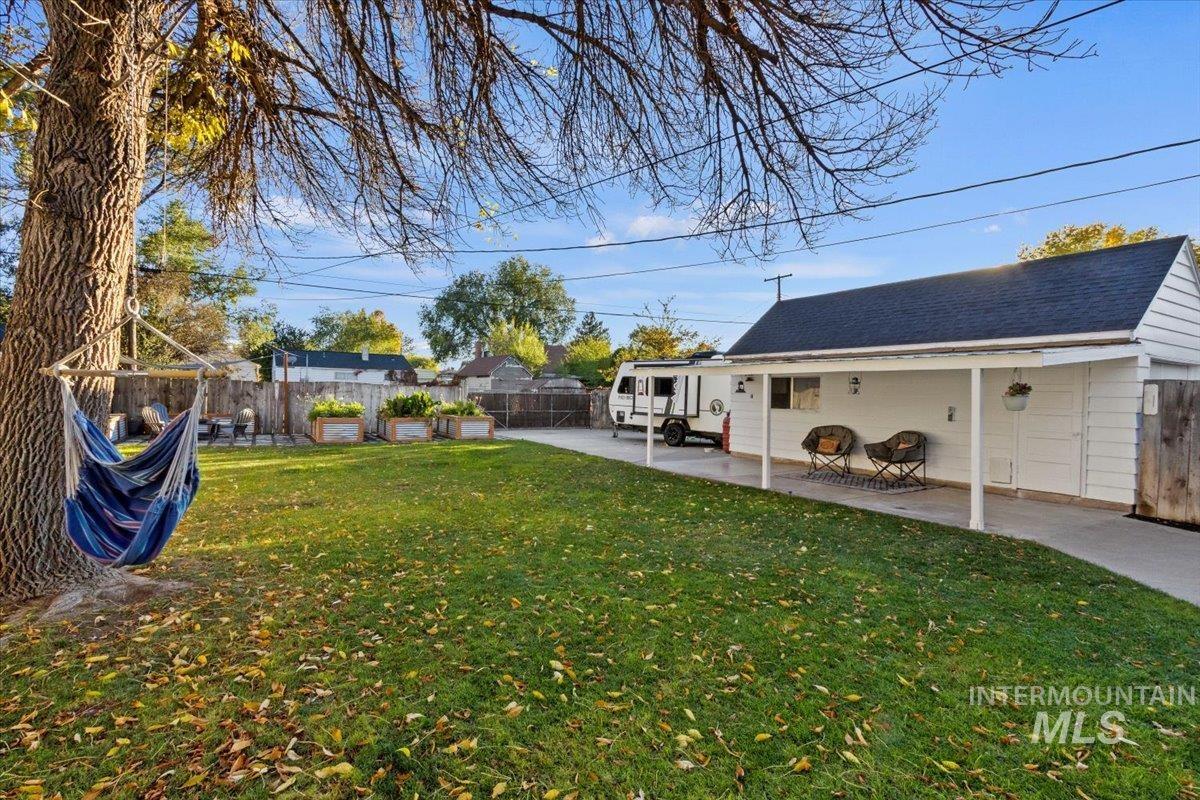 Fenced backyard featuring a patio