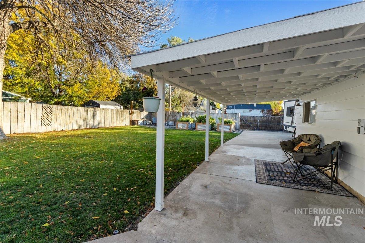 Fenced backyard with a patio area