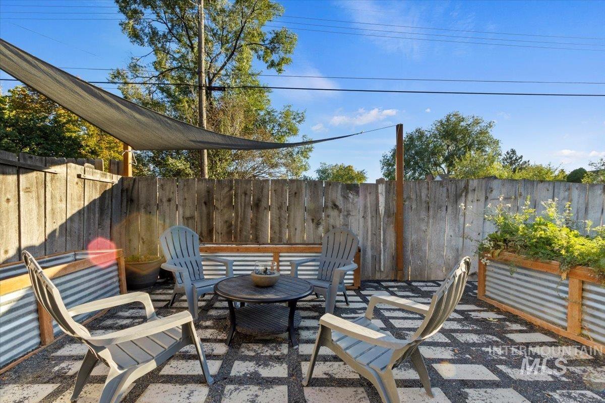 Fenced backyard with a patio area