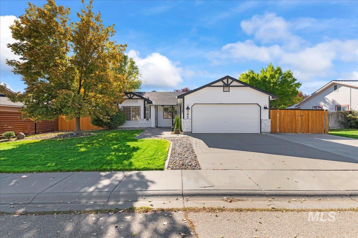 View of front of home featuring driveway and an attached garage