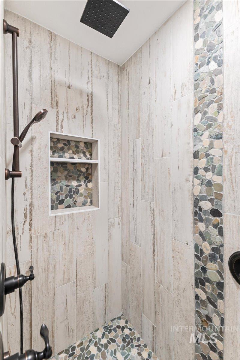 Full bath with a tile shower