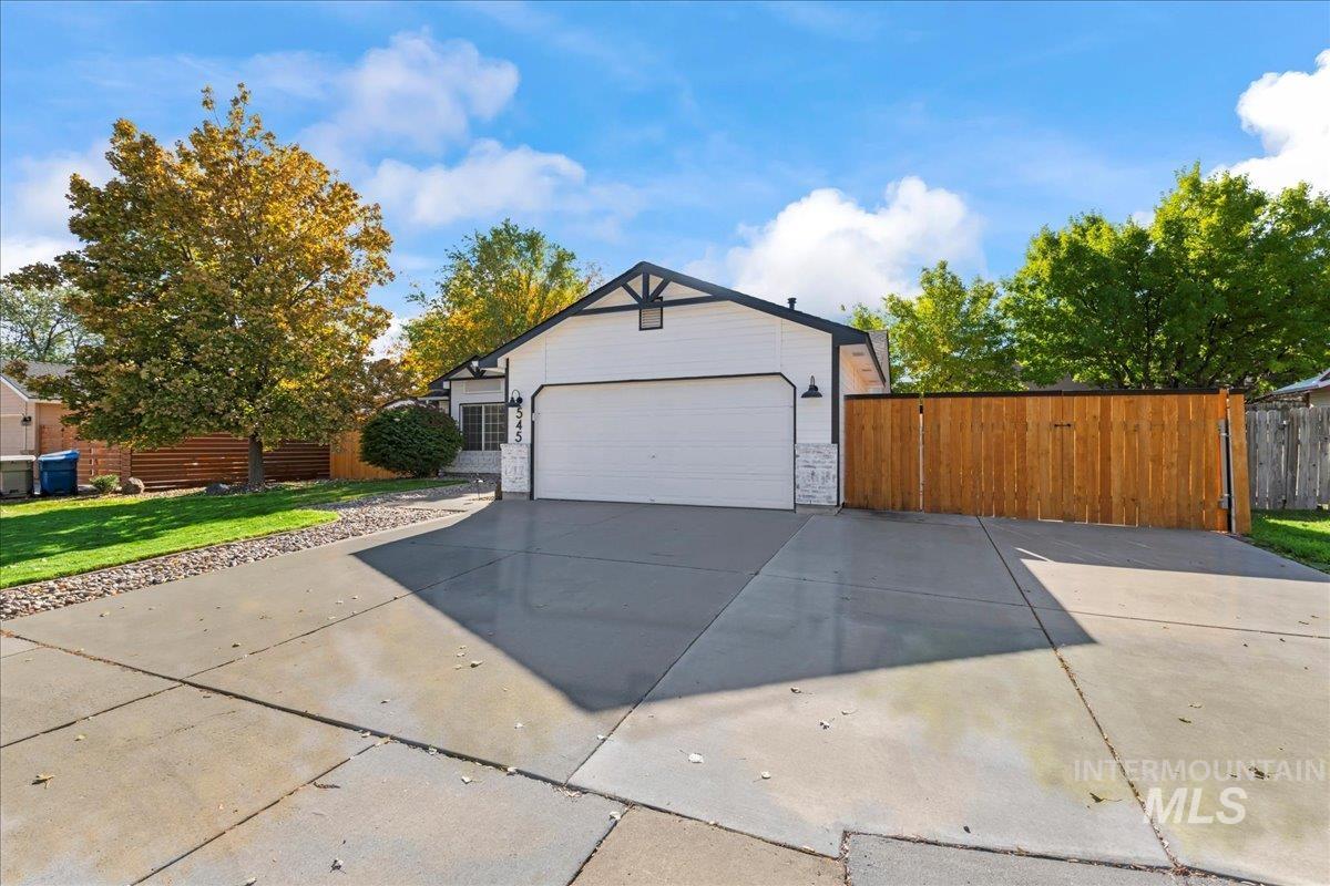 View of home's exterior with driveway and an attached garage