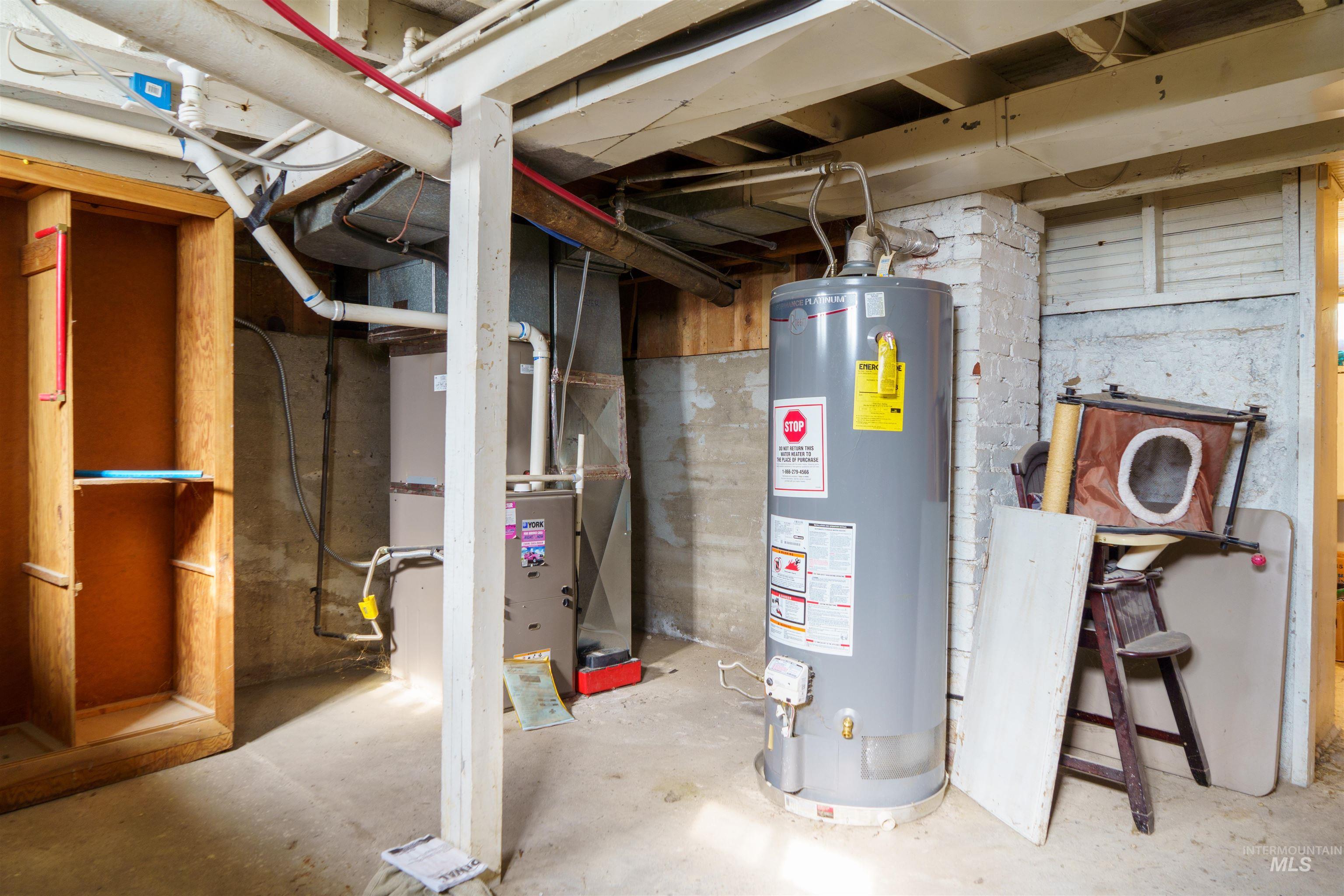 Utilities featuring gas water heater and heating unit