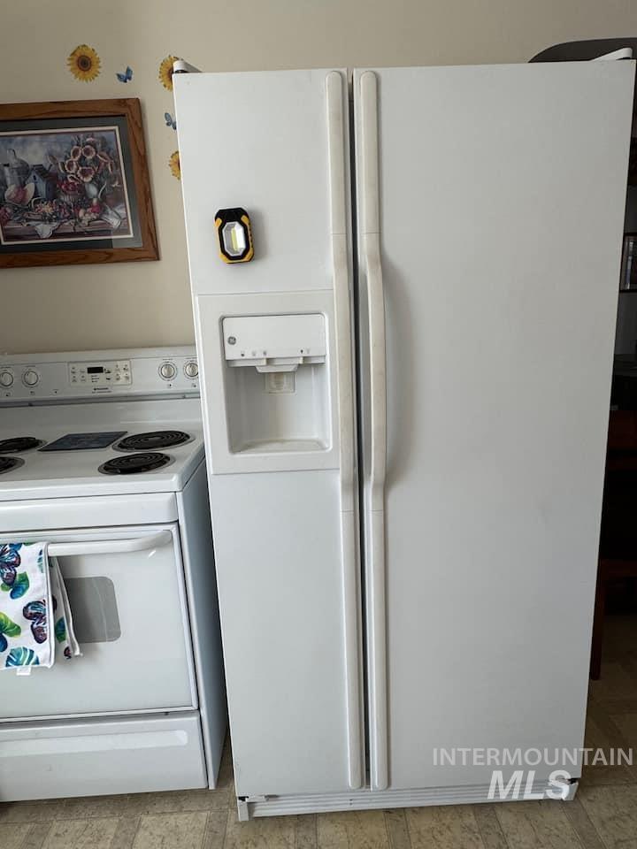 Kitchen featuring white appliances