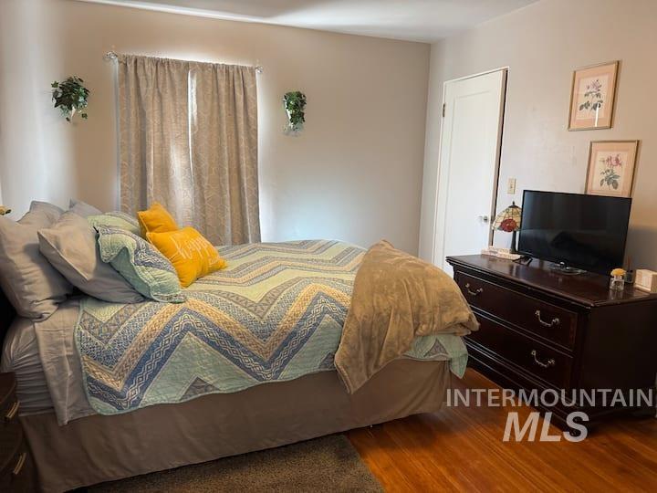 Bedroom with wood finished floors