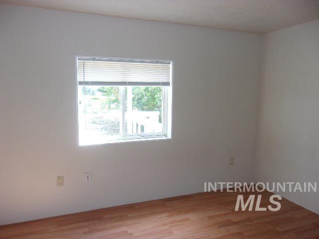 Spare room featuring light wood-style floors