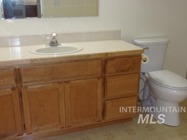 Bathroom featuring vanity and toilet