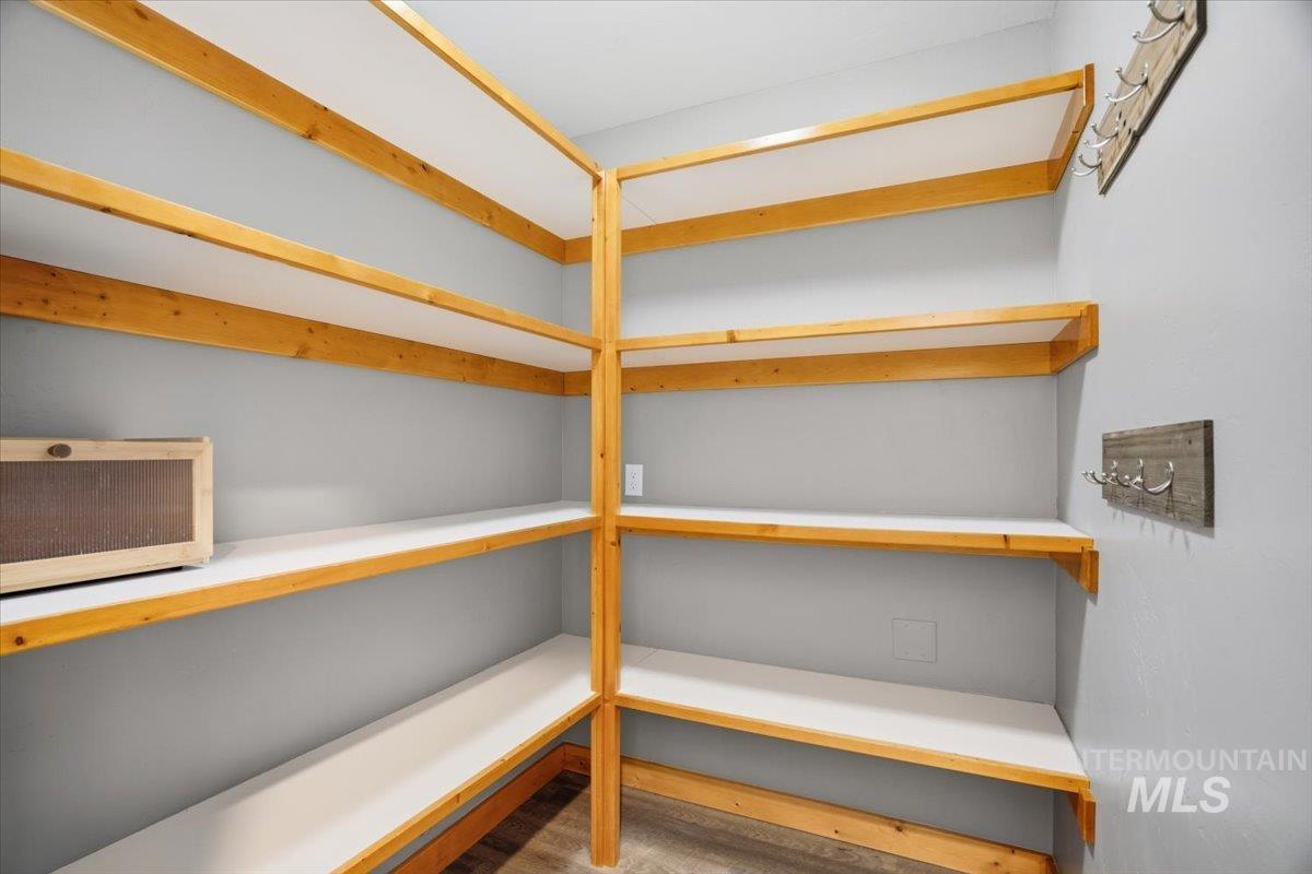 Storage area featuring a wall mounted air conditioner