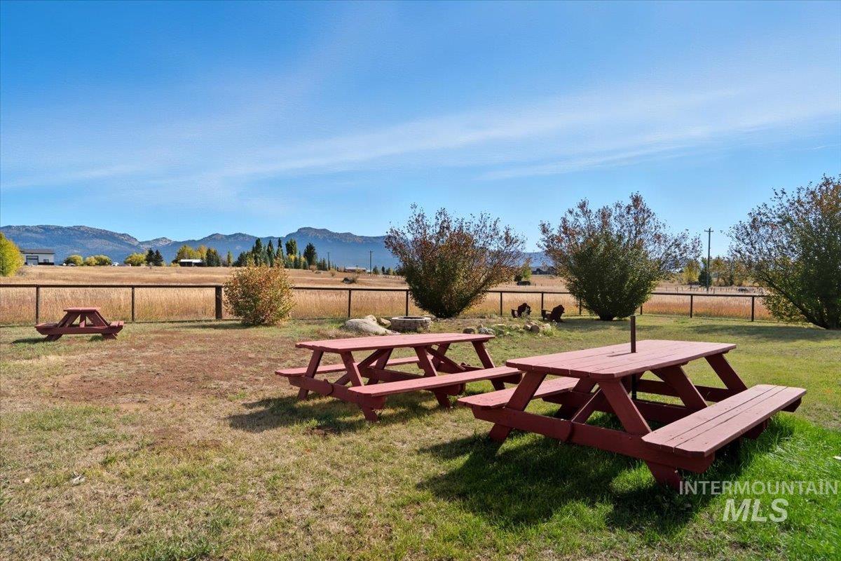 View of home's community featuring a mountain view and a view of rural / pastoral area