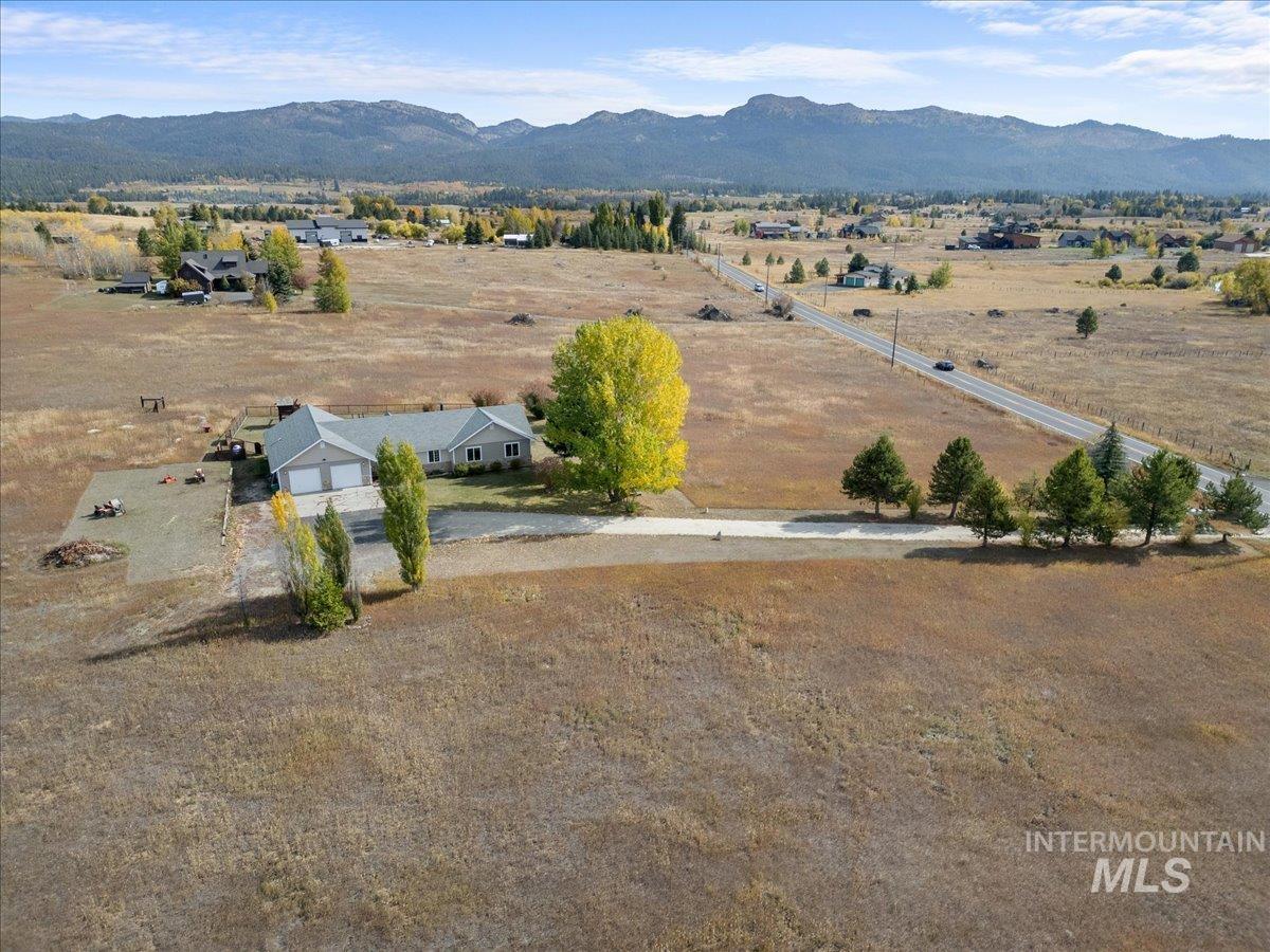 Aerial view of sparsely populated area with a mountain backdrop