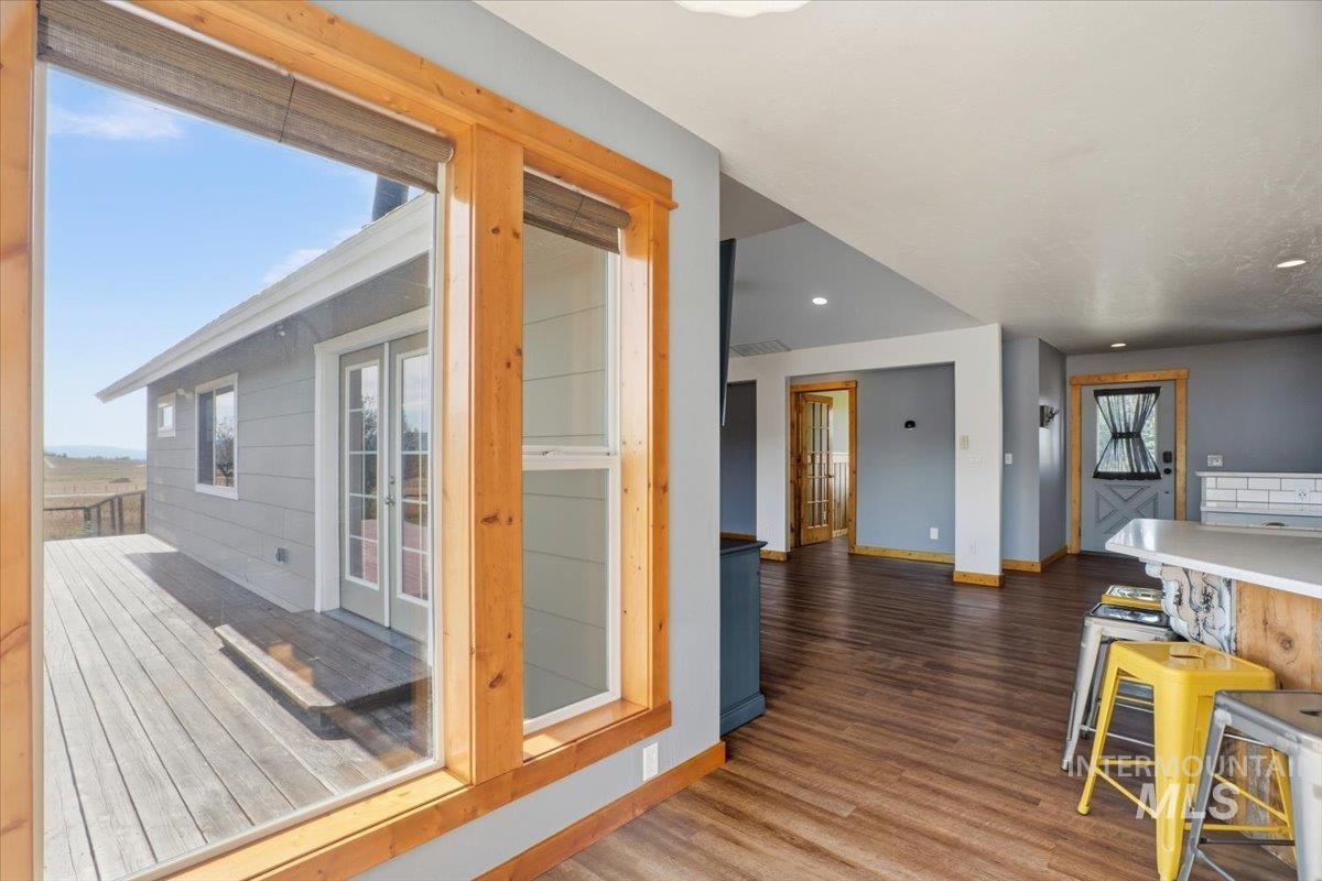 Entryway featuring wood finished floors and recessed lighting