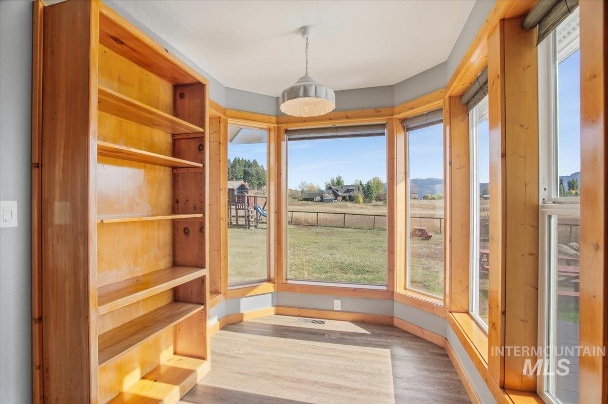 Unfurnished dining area with light wood-style floors