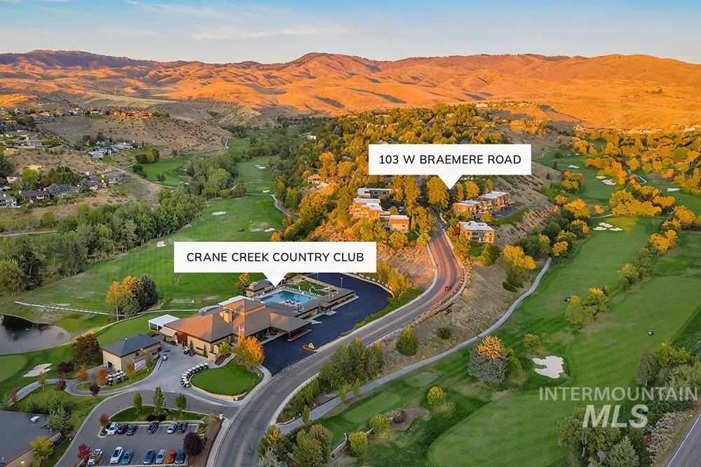 View of property location with mountains and a golf club