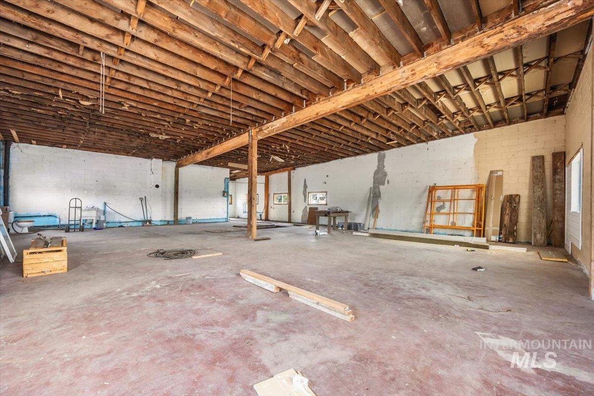 Garage featuring concrete block wall