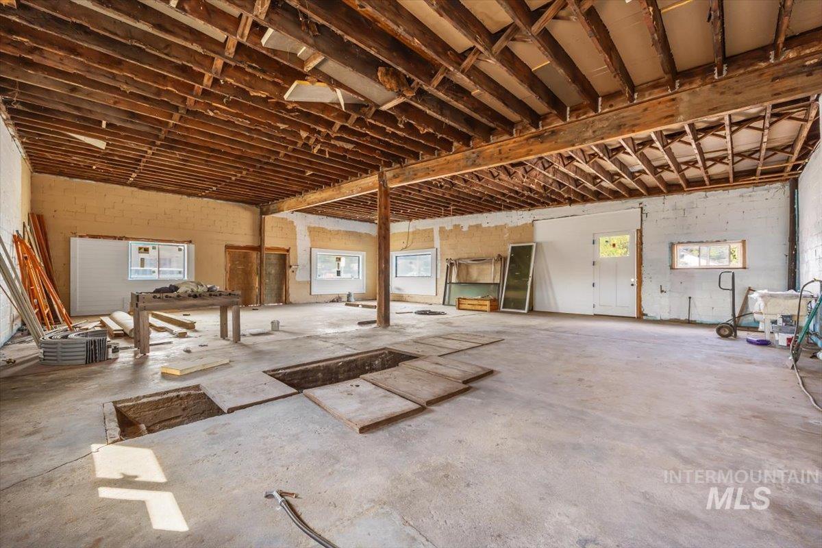 Garage featuring concrete block wall