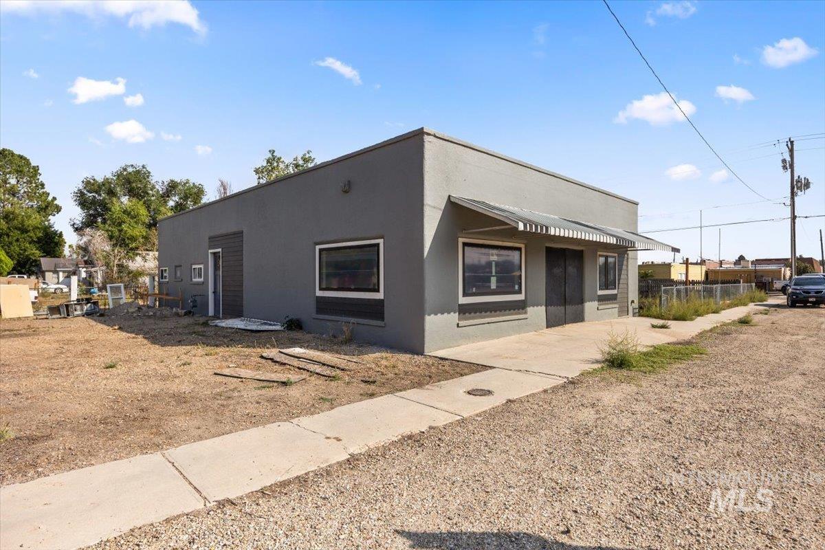 View of front facade featuring stucco siding