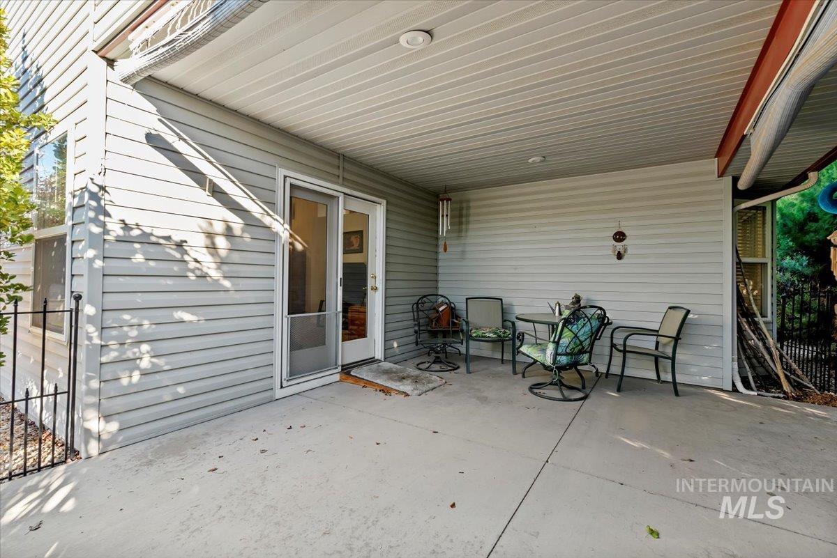 Covered patio with fenced yard