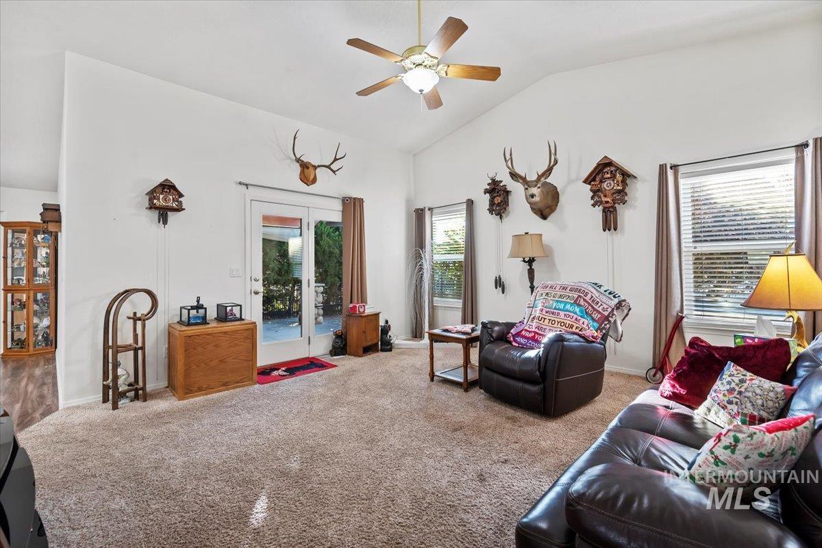 Living room featuring vaulted ceilings
