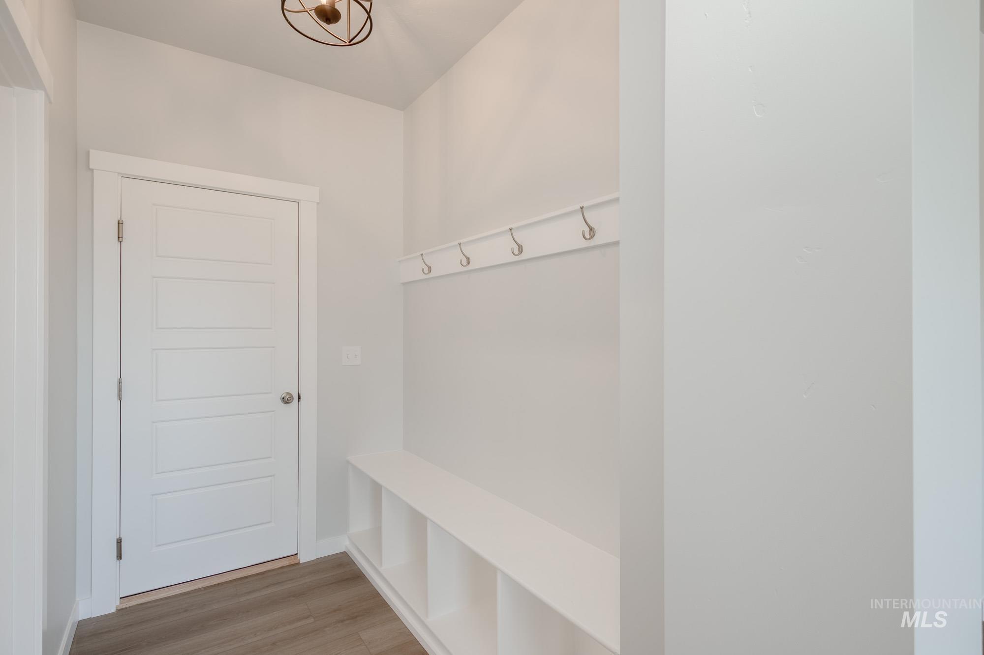 Mudroom featuring light wood-style floors
