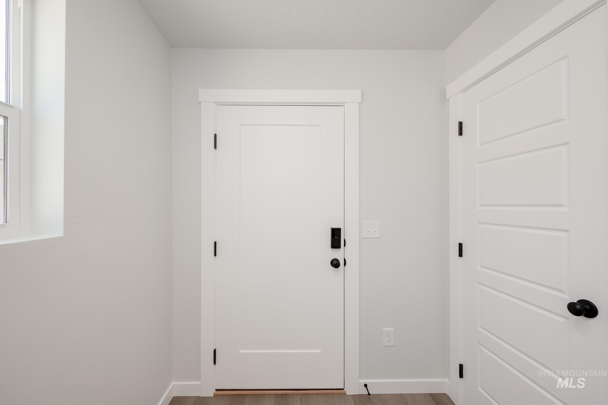 Doorway with wood finished floors