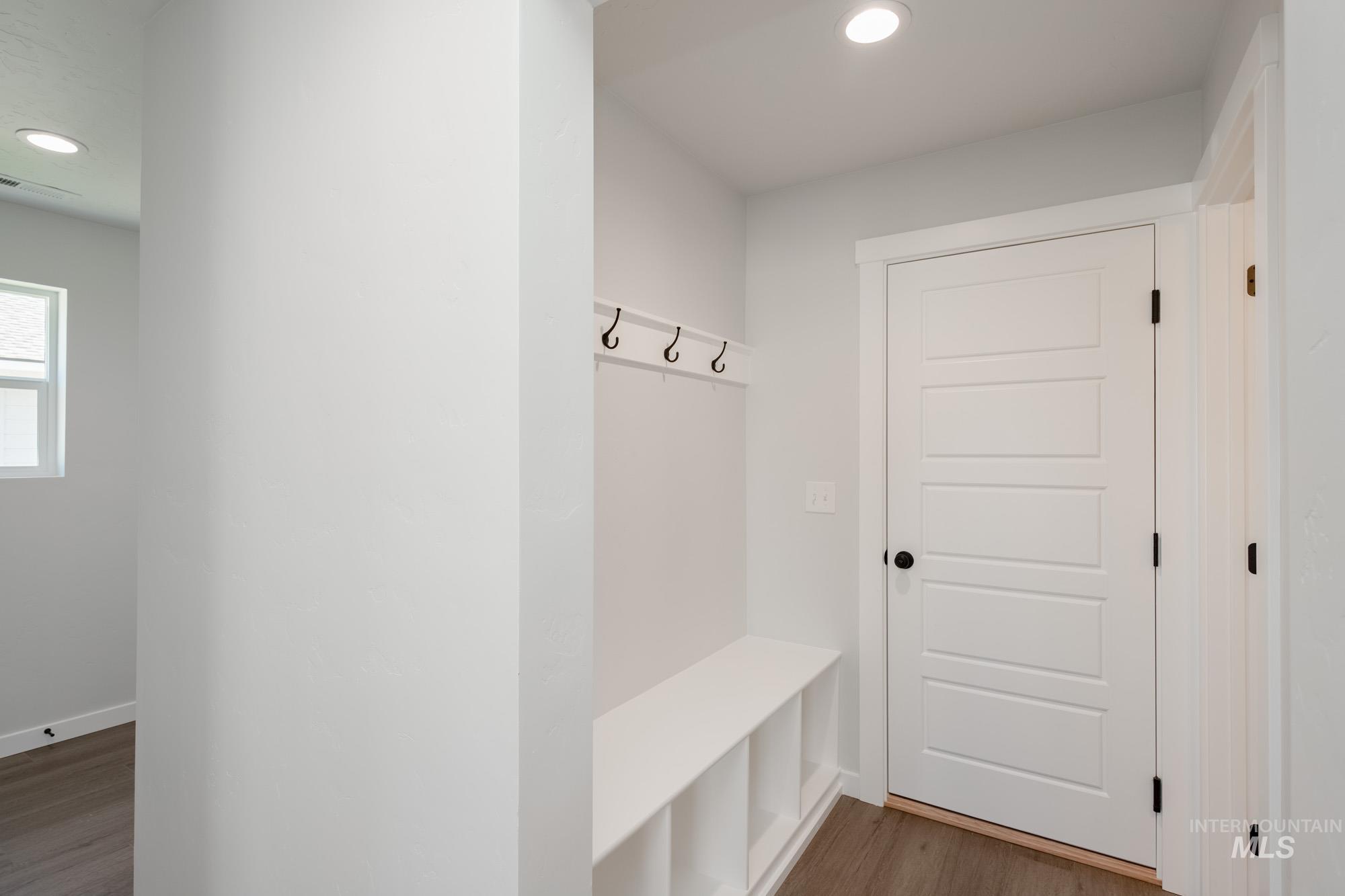 Mudroom with dark wood-type flooring and recessed lighting