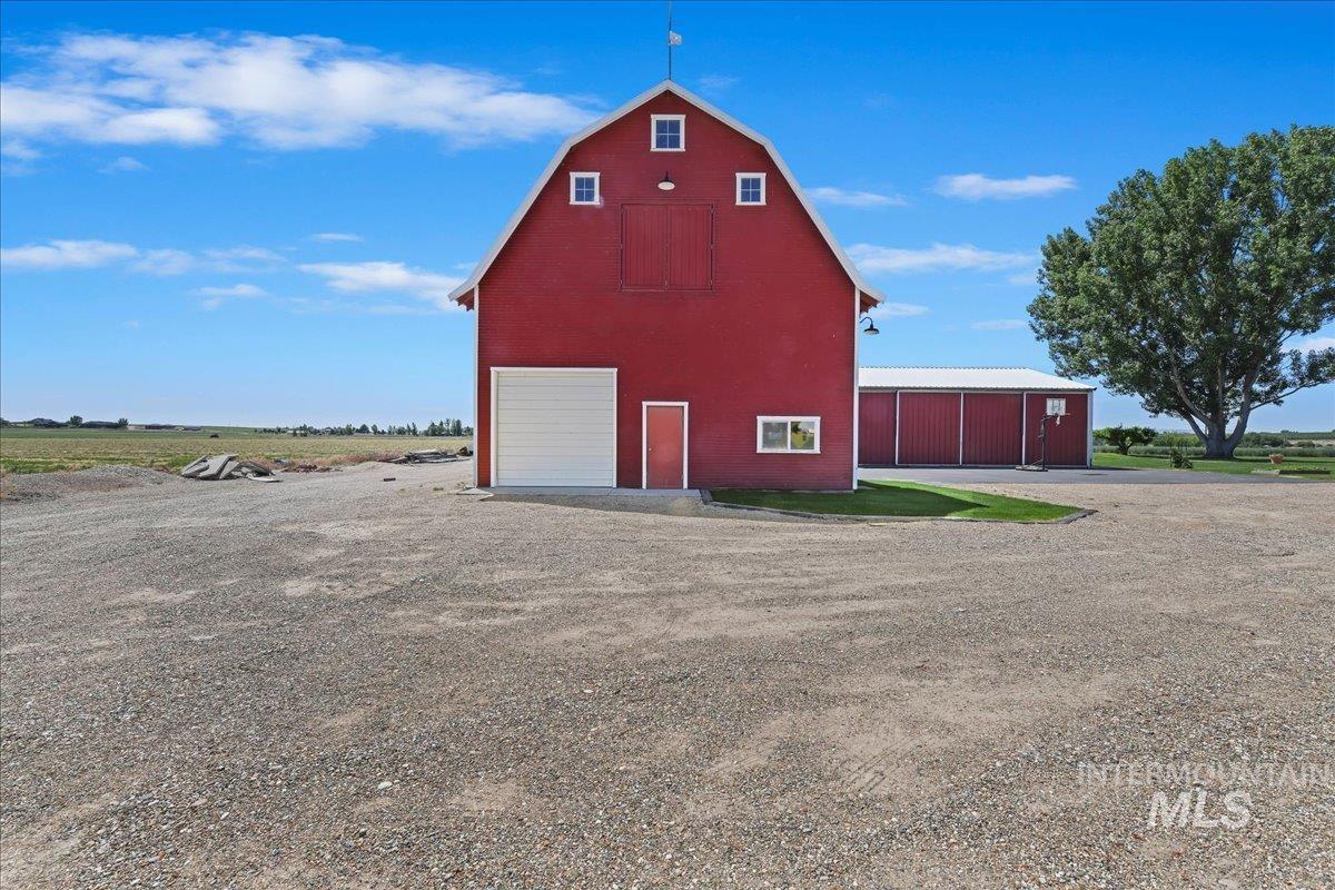 View of barn featuring driveway