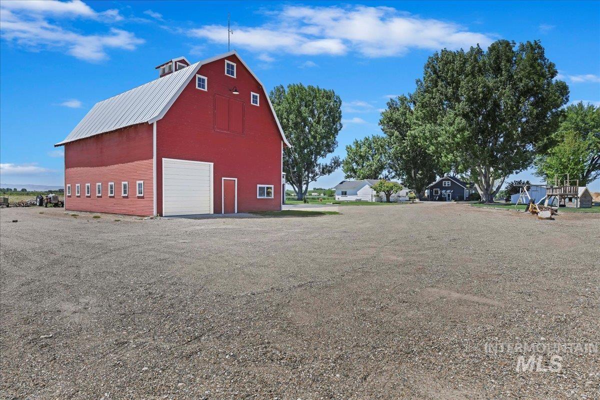 View of barn with driveway