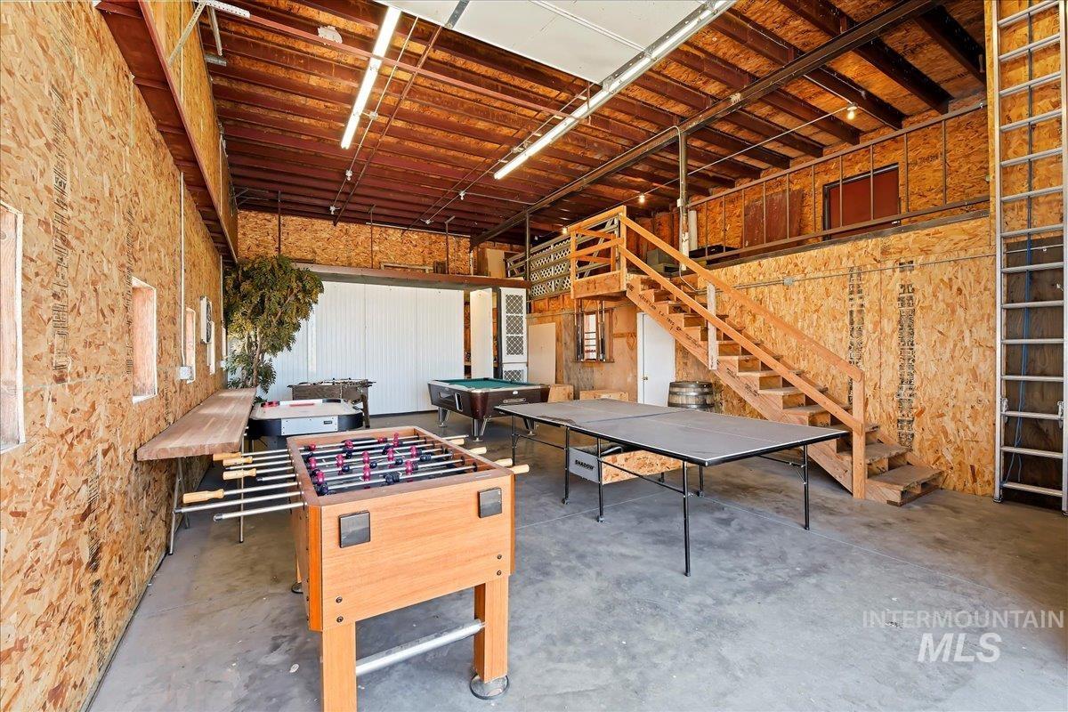 Rec room with concrete flooring