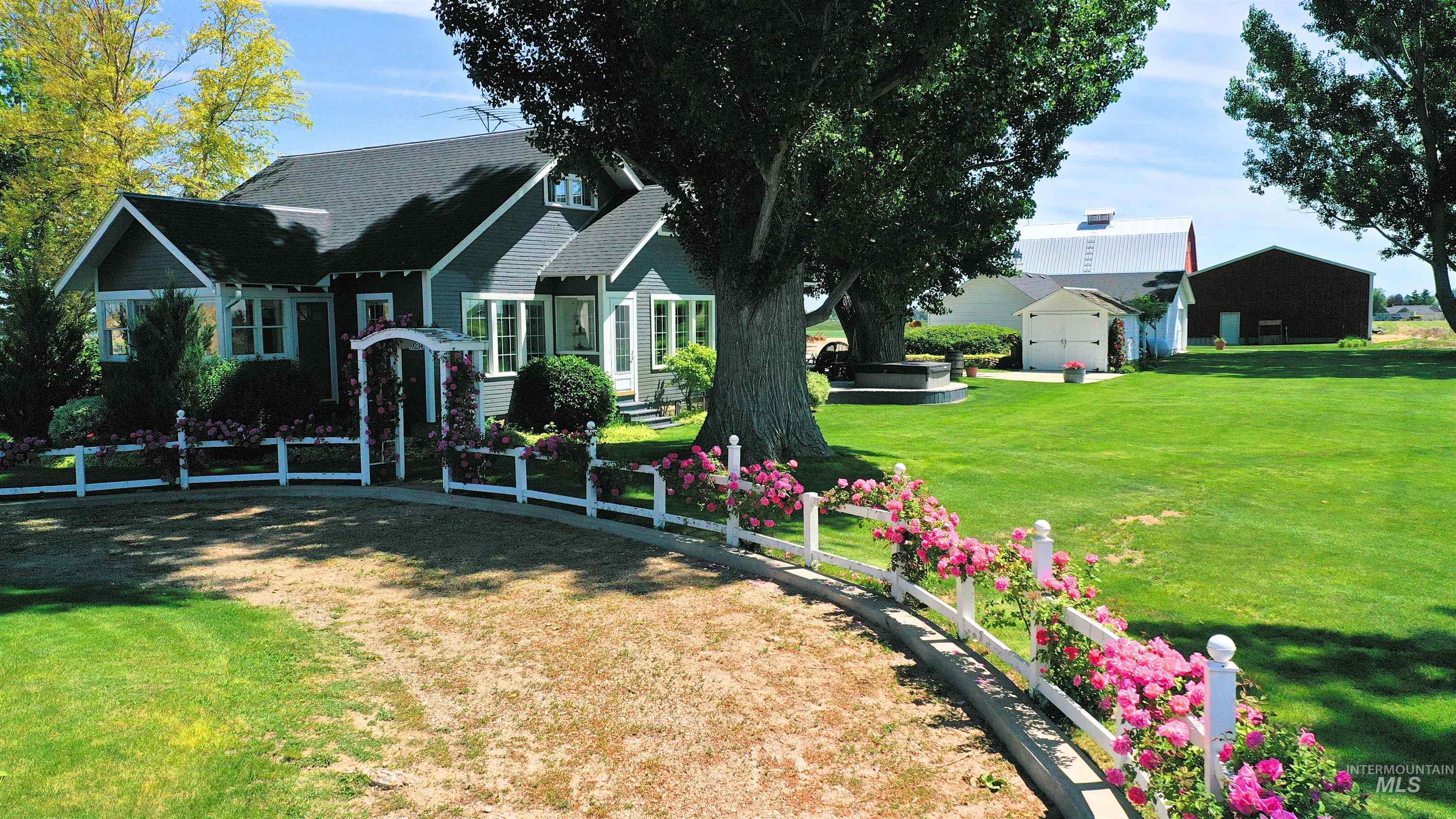 View of green lawn featuring an outbuilding