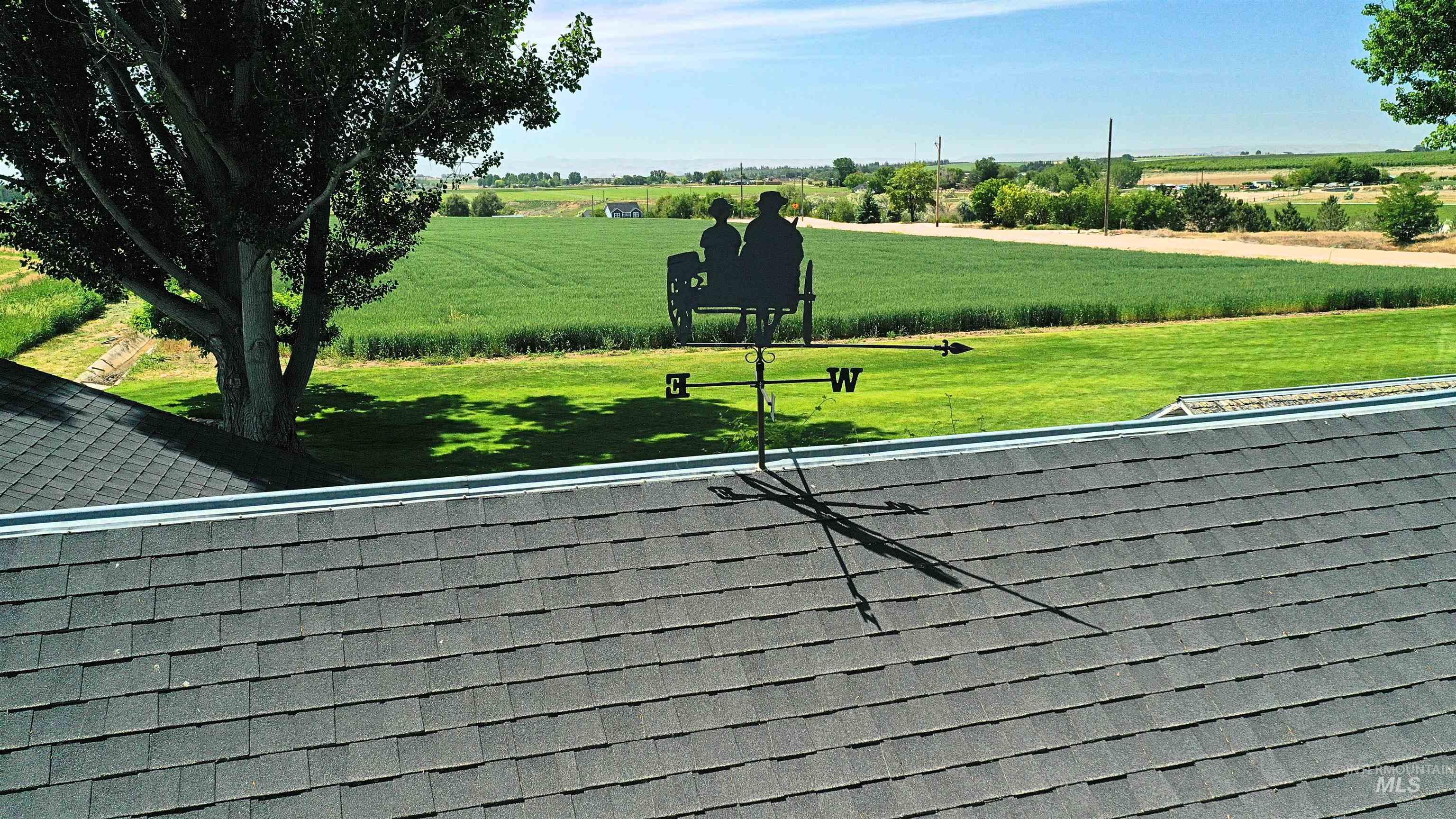 View of property's community featuring a view of rural / pastoral area and a lawn