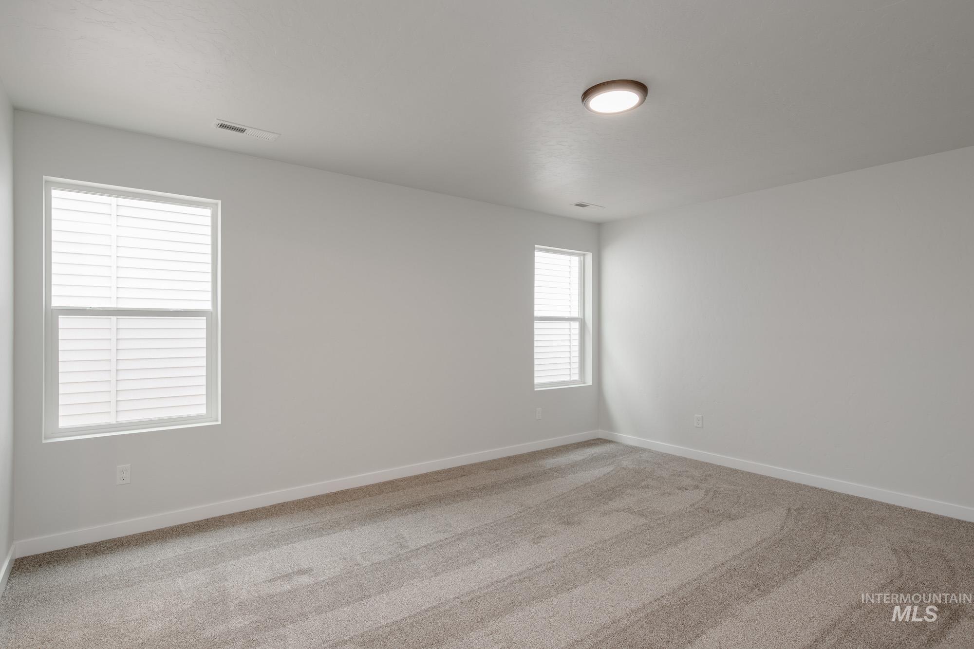 Spare room featuring carpet floors