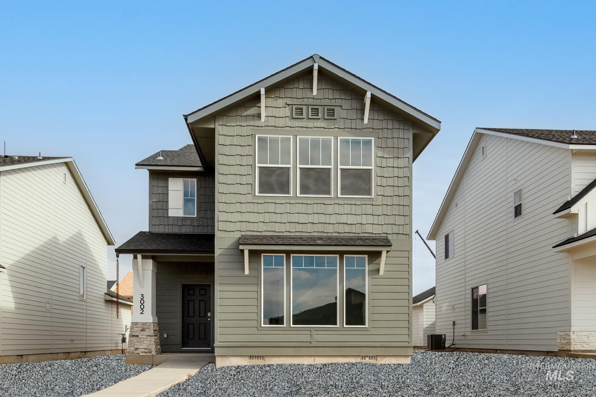 View of front of property featuring roof with shingles