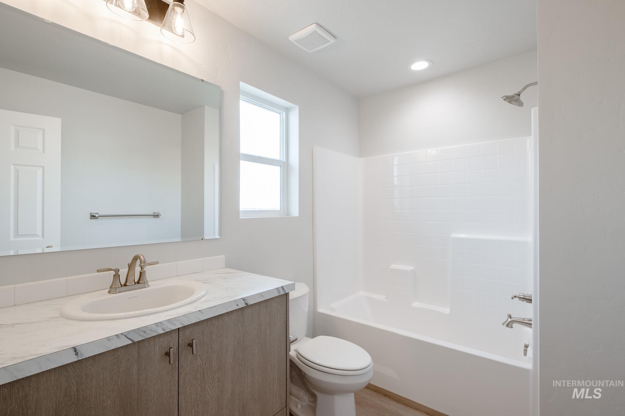 Full bathroom featuring bathing tub / shower combination and vanity