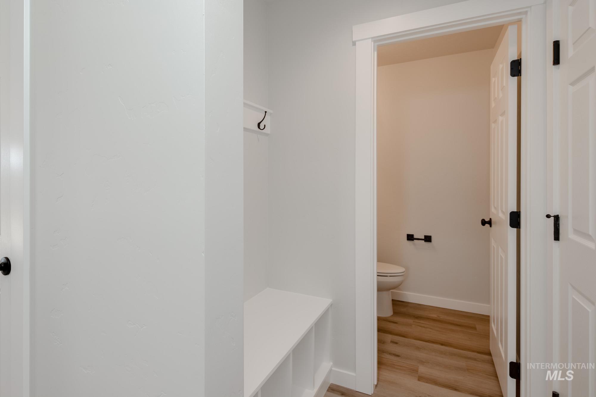 Bathroom featuring light wood-type flooring and a walk in shower