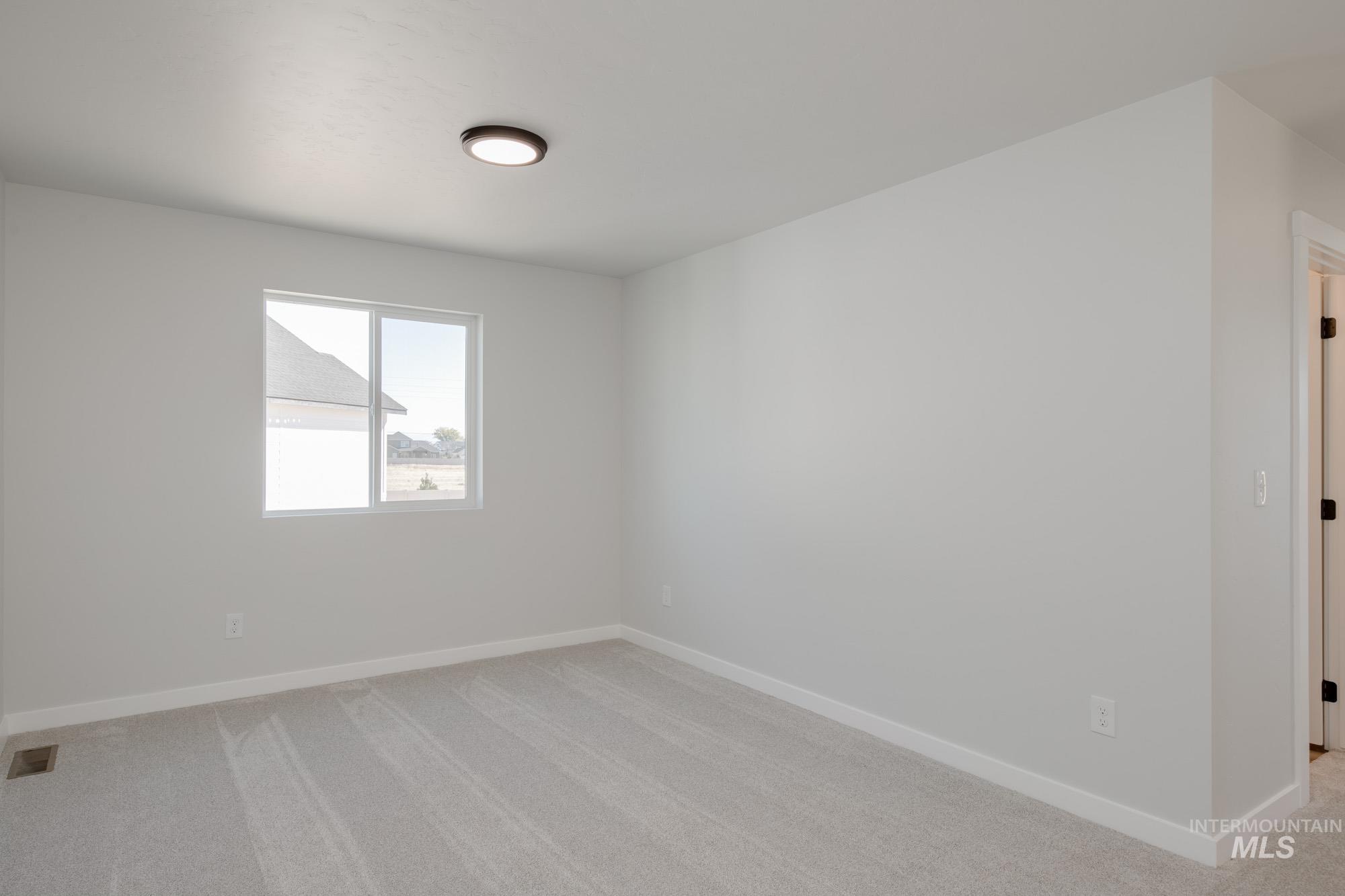 Spare room with light carpet