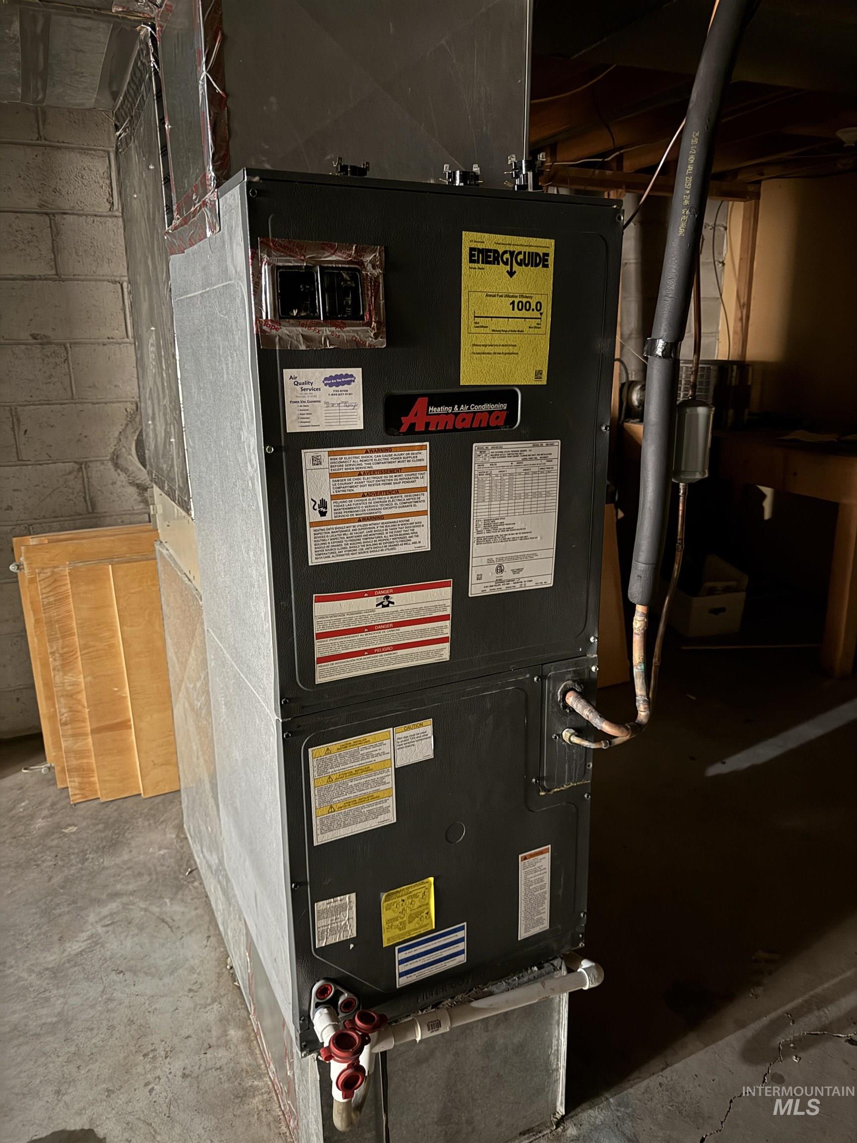 Utility room featuring heating unit